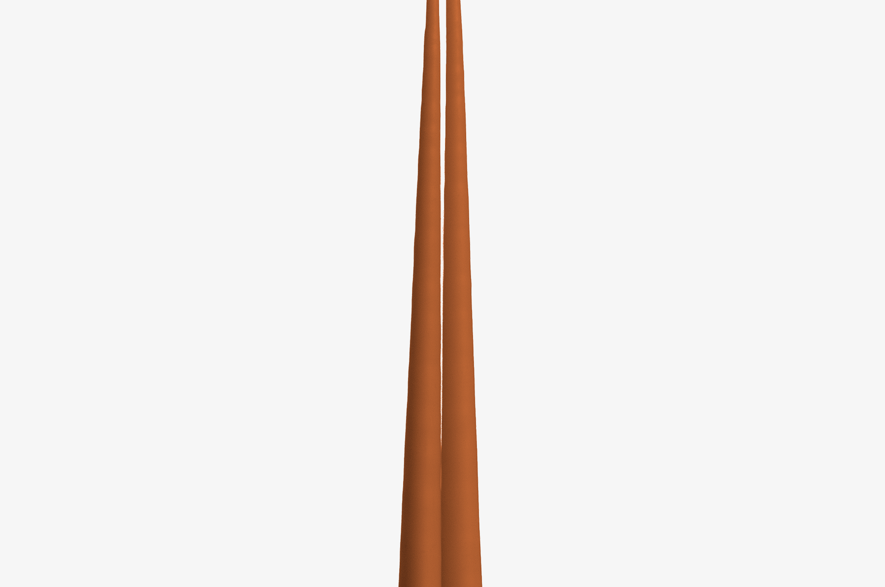 Two tall, thin, orange candles on a white background