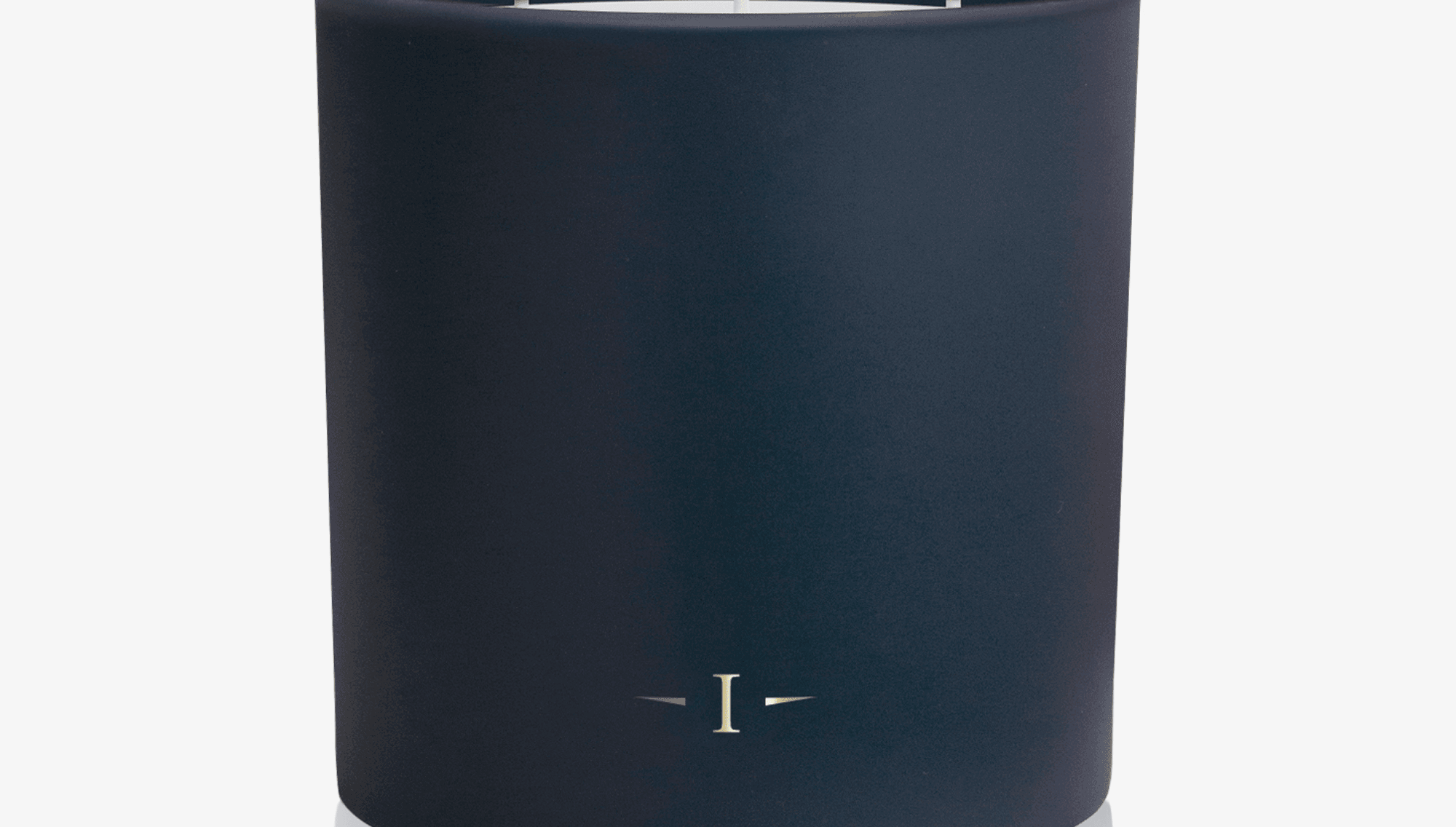 Navy blue candle with three wicks on a white background