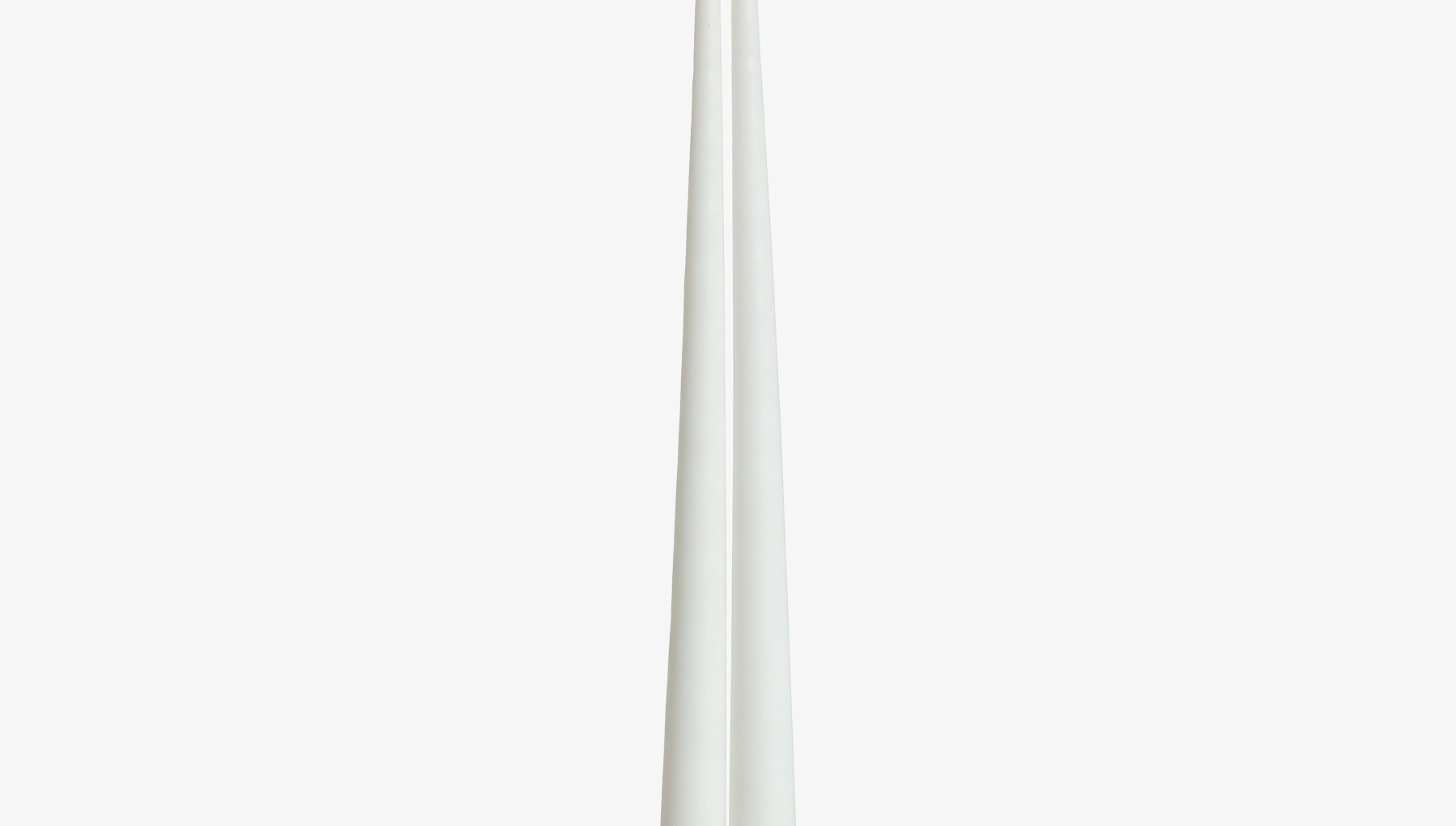Two white candles on a white background