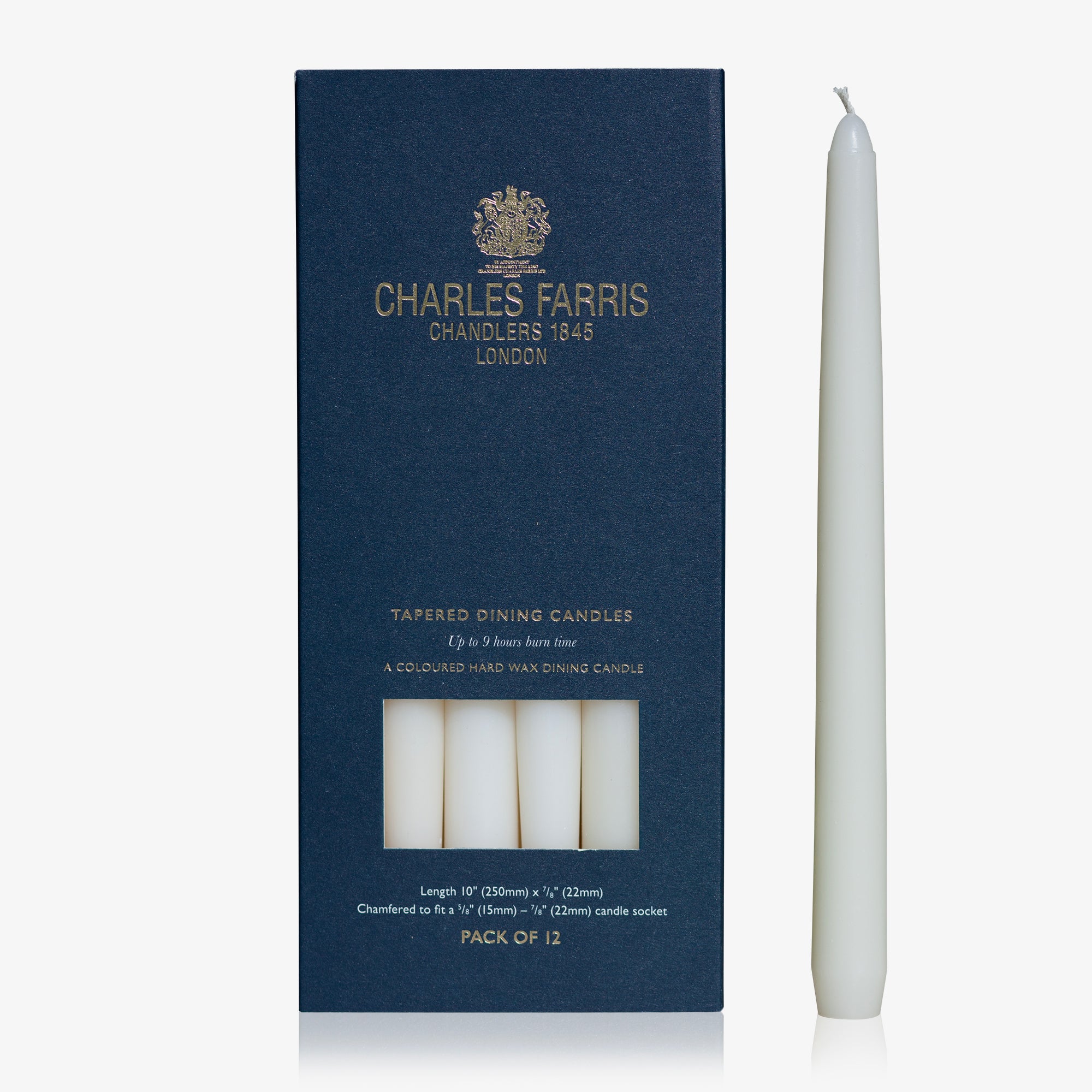 White tapering dining candle next to its packaging with 'Charles Farris' branding on a white background.