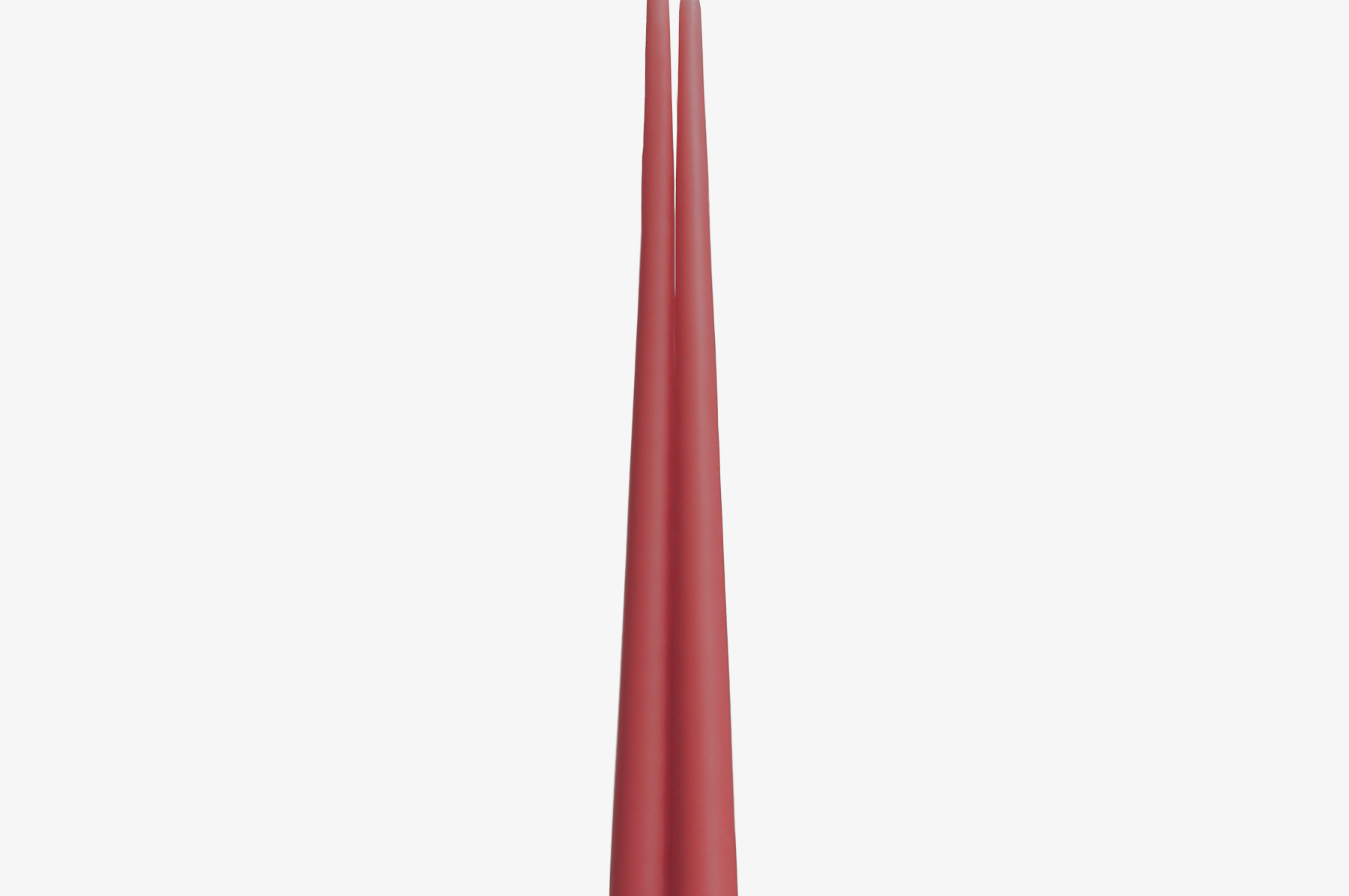 Two pink red candles on a white background