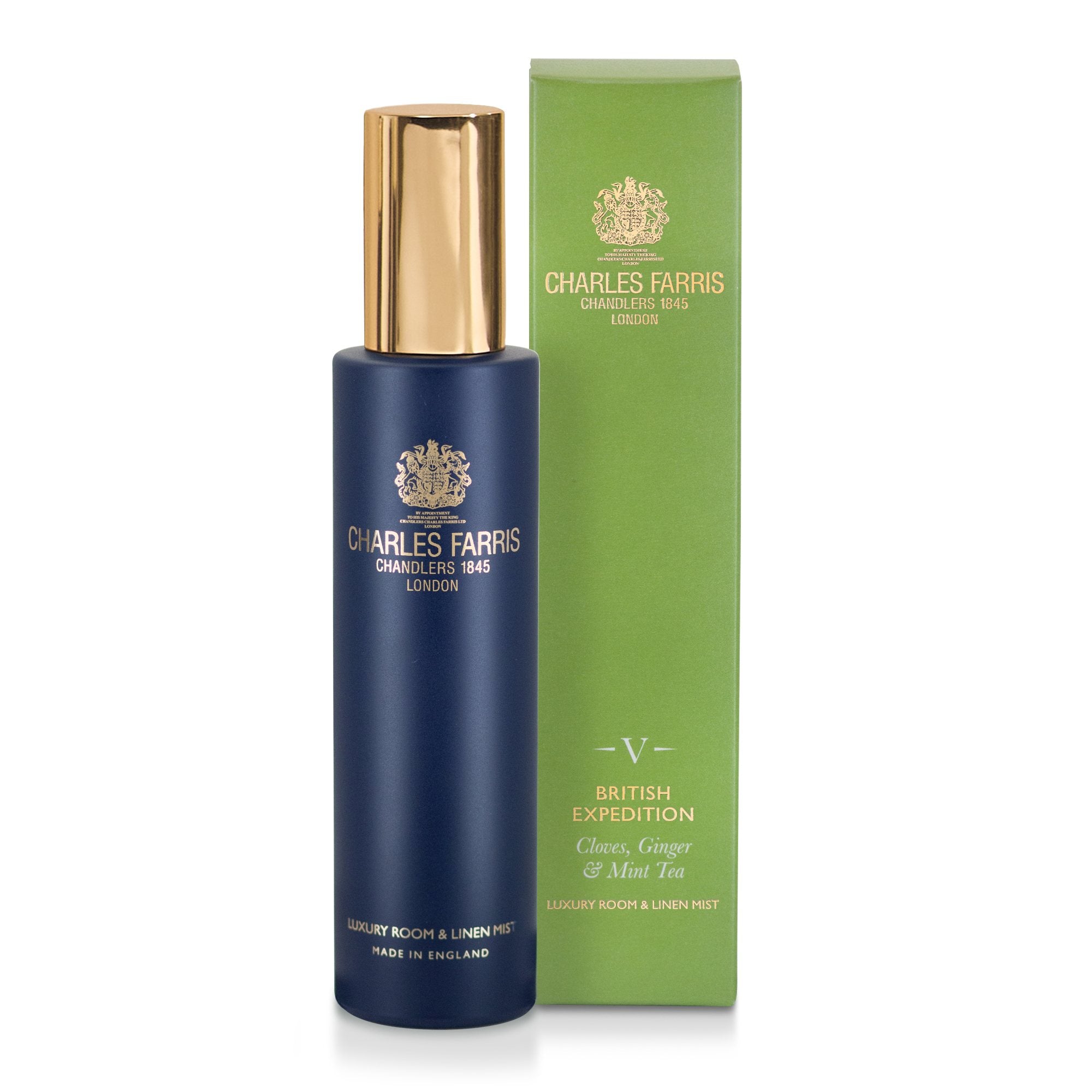 Charles Farris British Expedition room mist cloves, tobacco, mint scented home spray in navy blue bottle next to its green packaging.