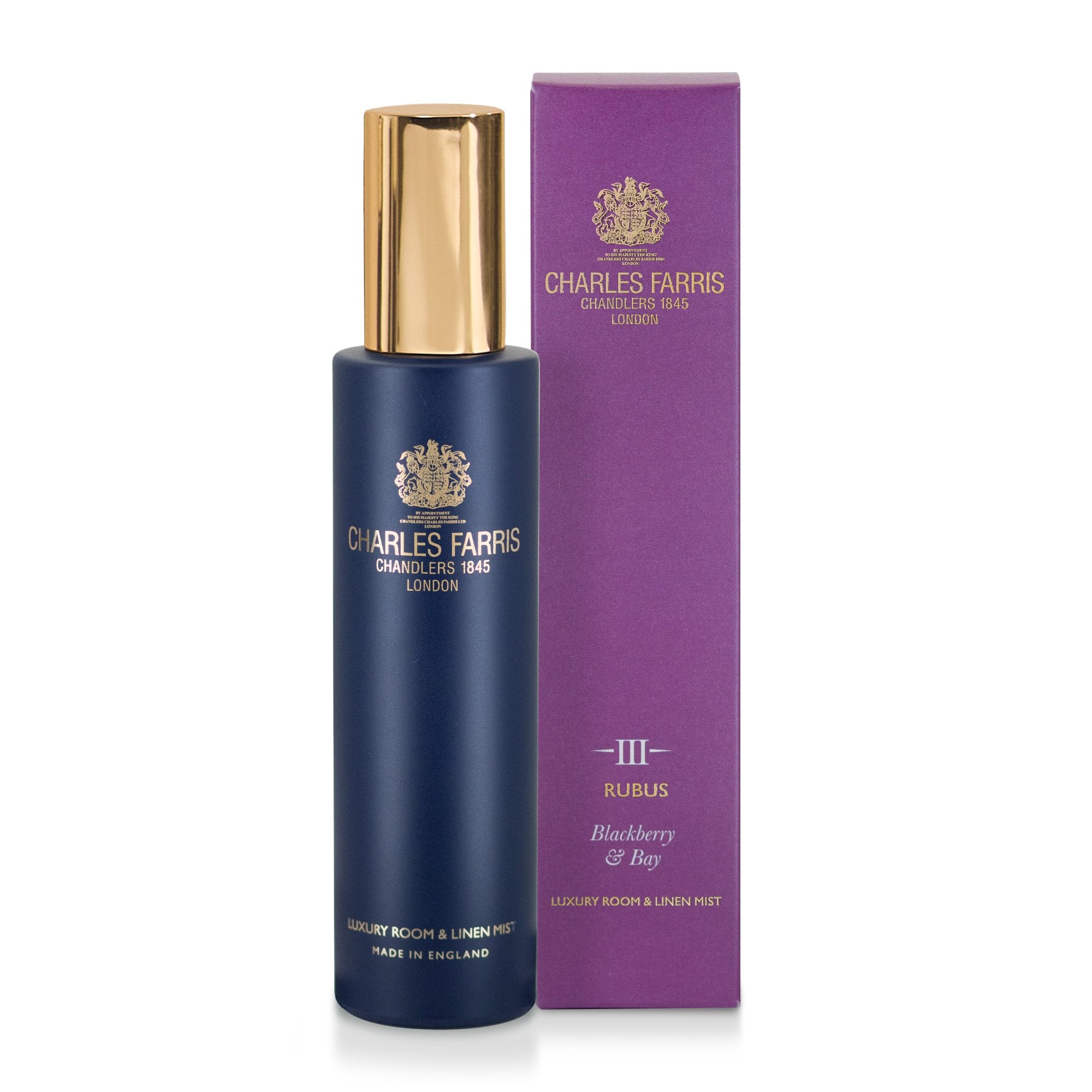 Charles Farris Rubus 100ml room spray in navy bottle with gold cap, beside its purple blackberry and bay gift box