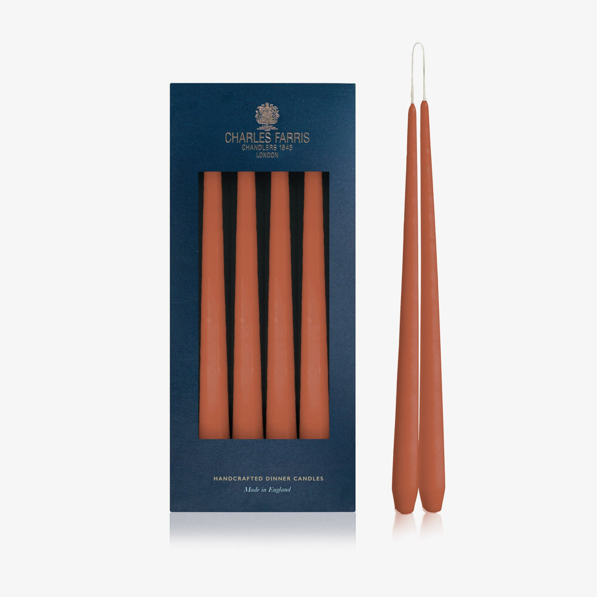 Charles Farris Terracotta hanging pair dinner candles in their navy box, with one pair joined at the wick, made in England