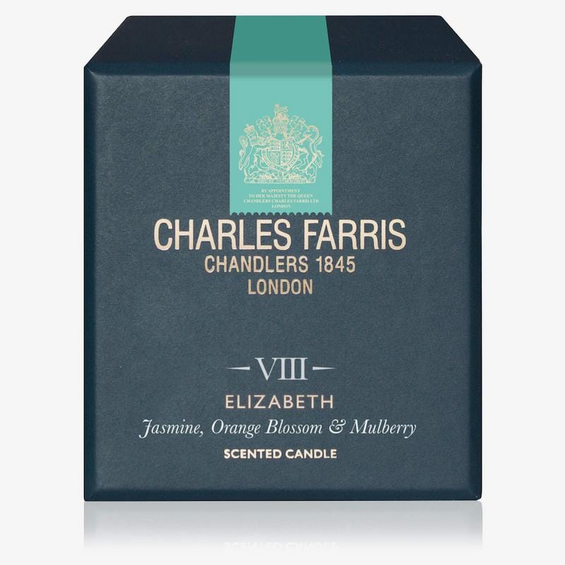 Charles Farris scented candle box with teal ribbon and gold text on a white background