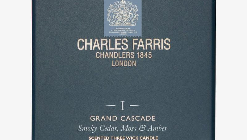 Blue box of Charles Farris candle with brand logo and product details.
