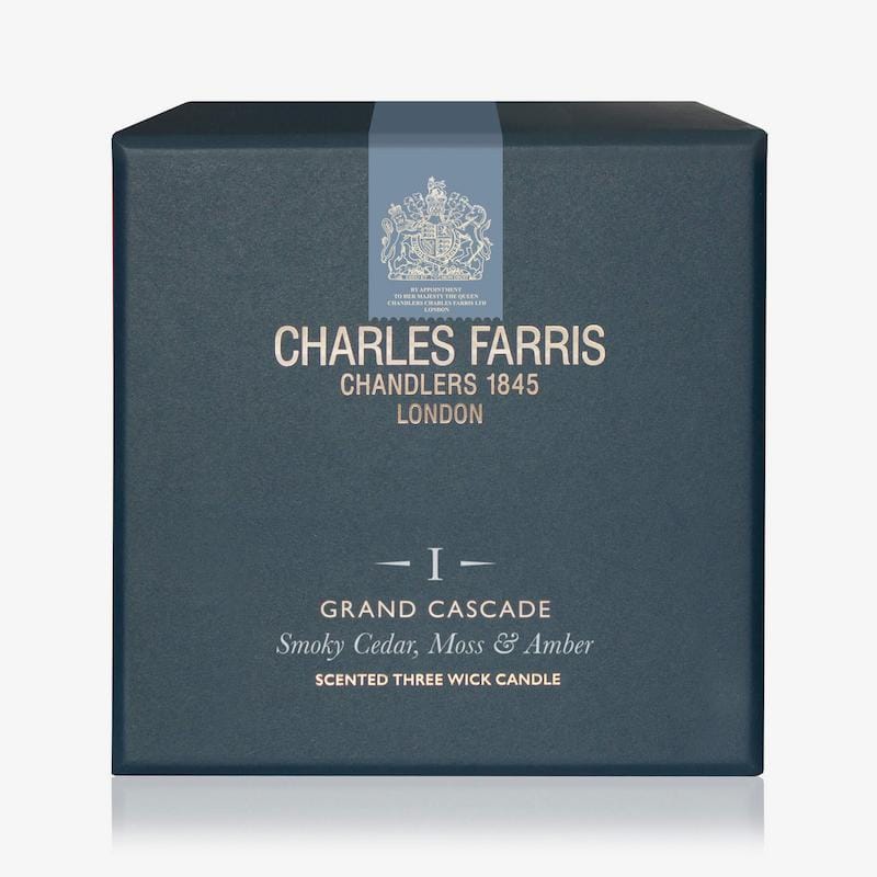 Blue box of Charles Farris candle with brand logo and product details.