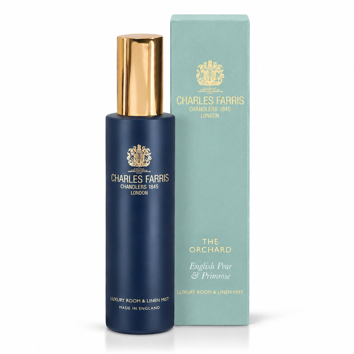 Charles Farris Orchard pear, jasmine fresia room mist scented home spray next to its blue packaging.