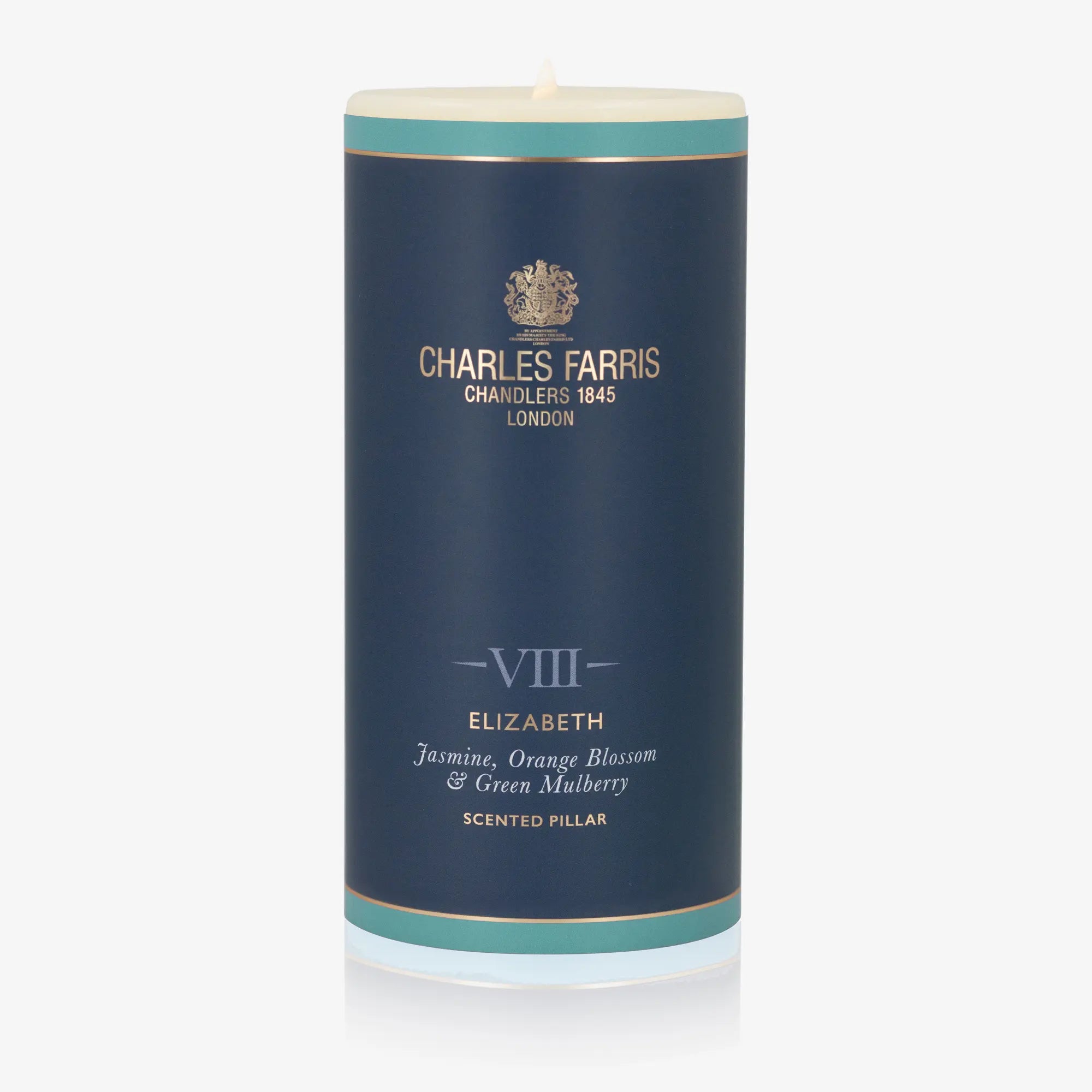 Scented pillar candle with 'Charles Farris' branding on a white background