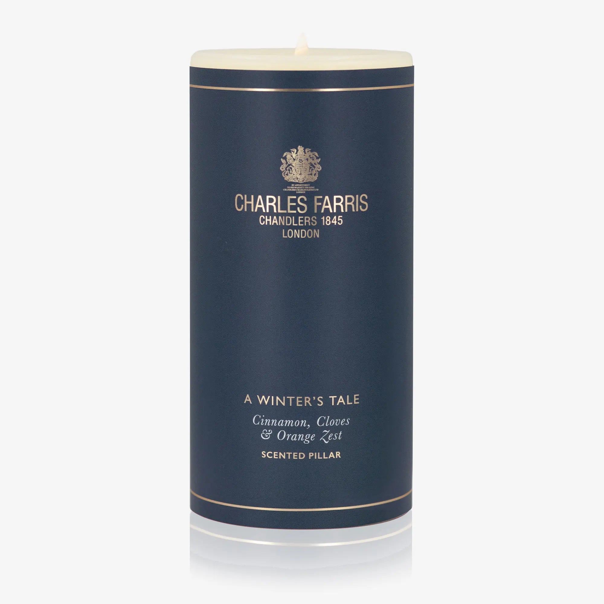 Scented pillar candle with 'Charles Farris' branding on a white background