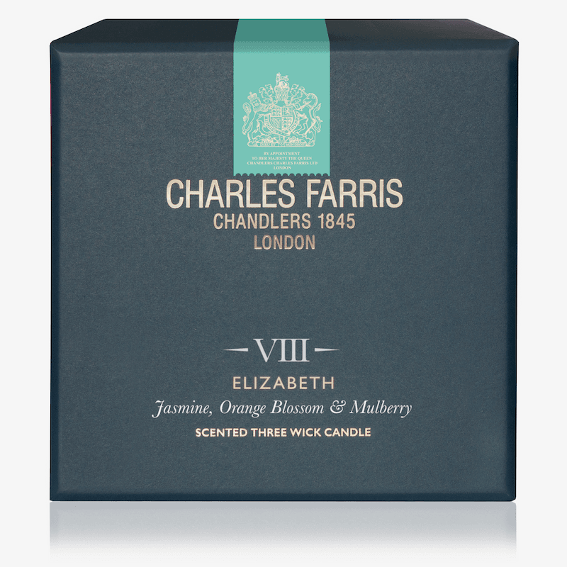 Box of Charles Farris candle with teal ribbon and brand logo