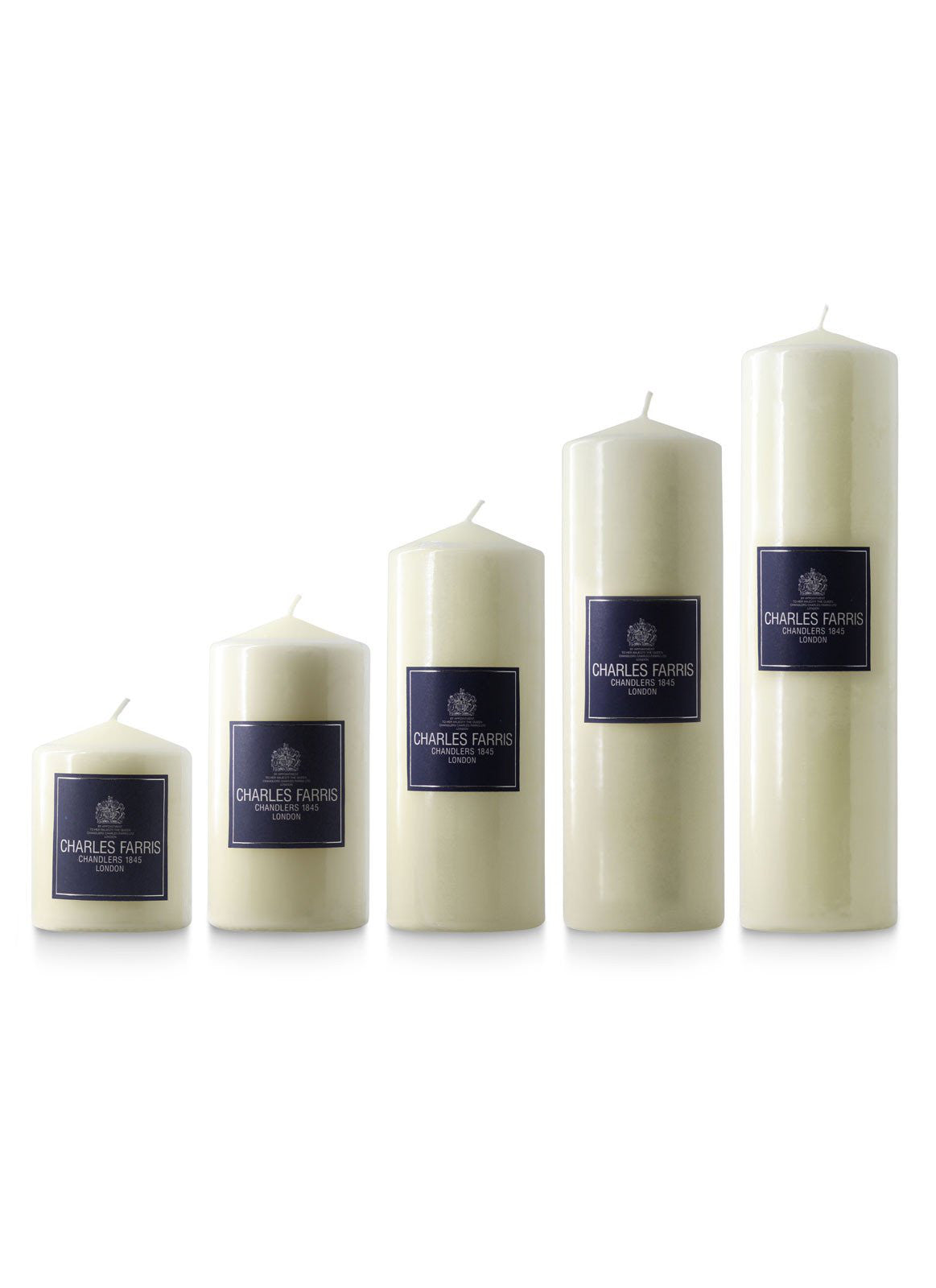 Set of five white candles with blue labels on a white background