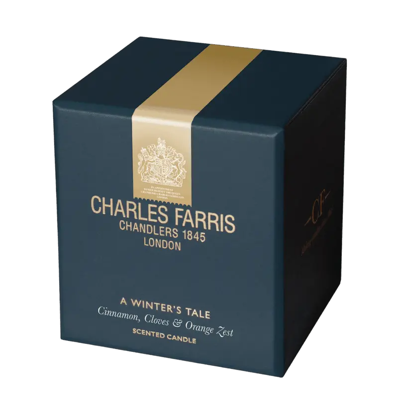 Blue box of Charles Farris scented candle with gold band on a white background