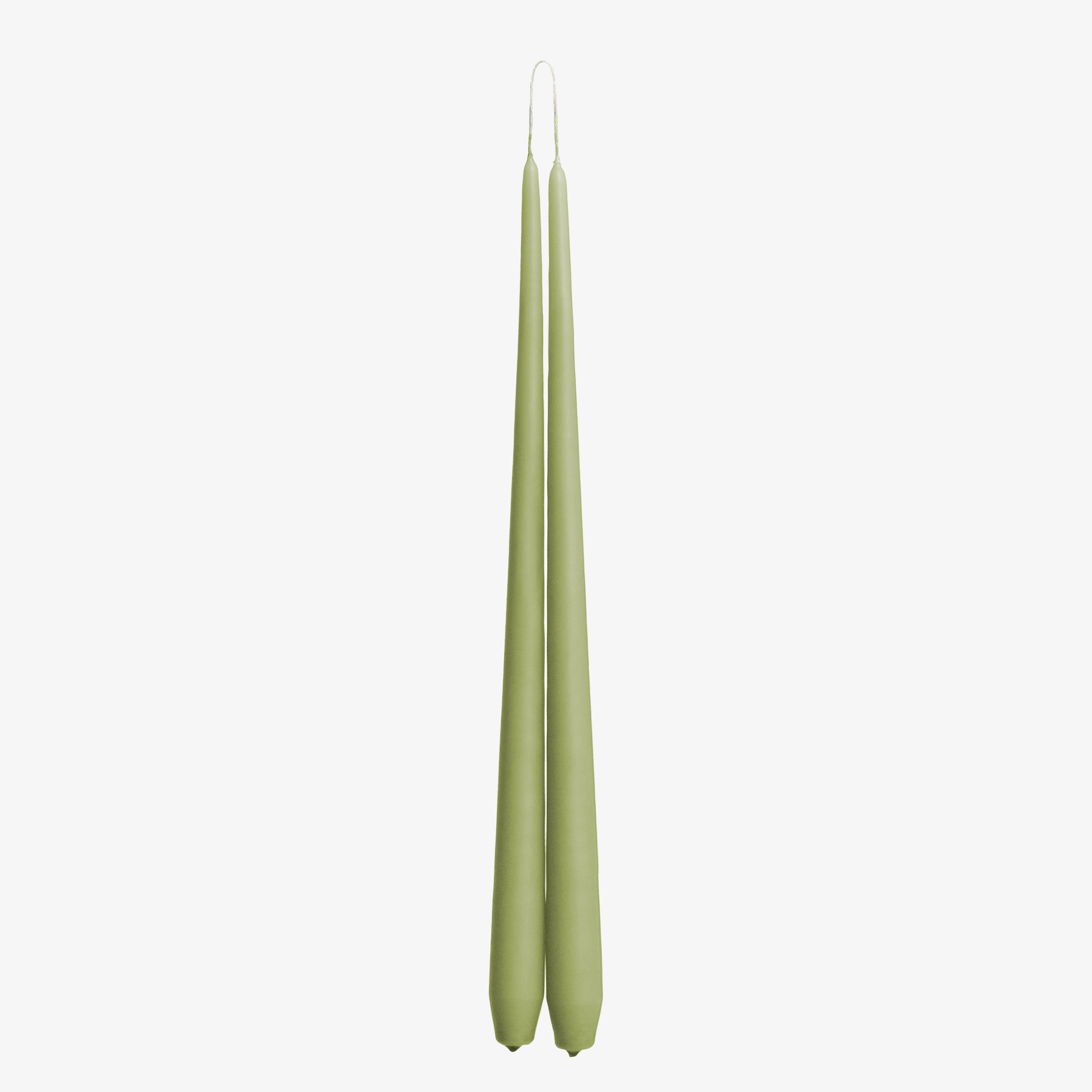 Two green candles on a white background