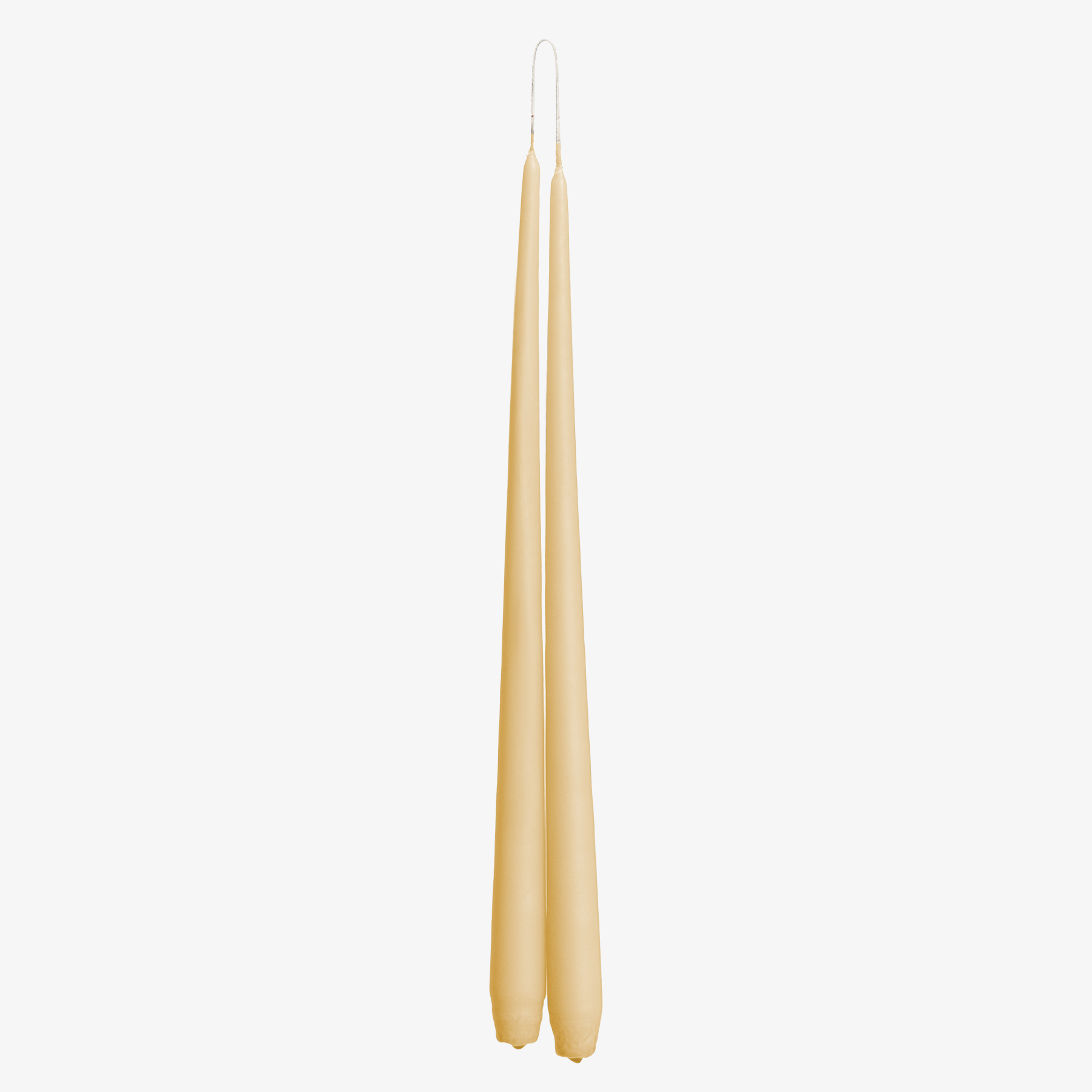 Two ivory candles on a white background