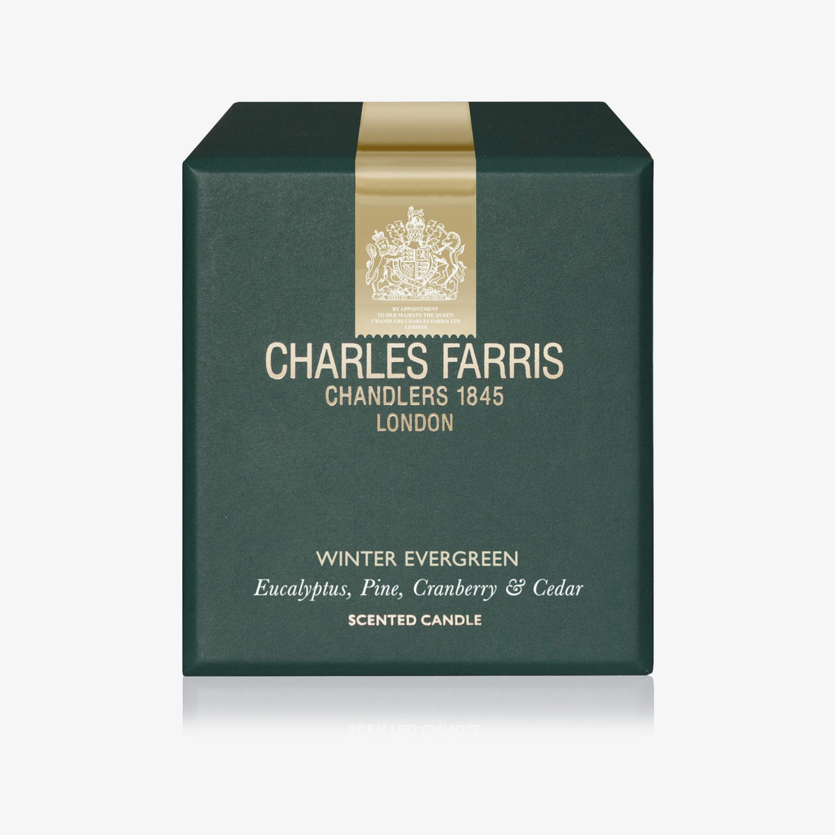 Green box of Charles Farris scented candle with gold accents on a white background