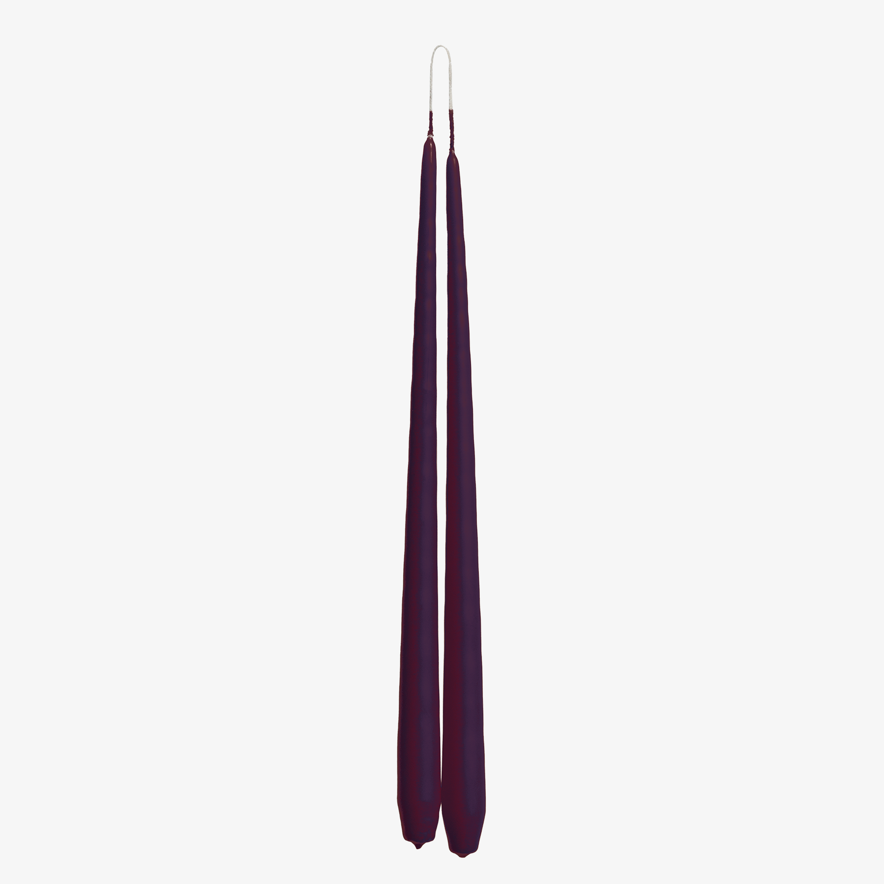 Two purple candles on a white background