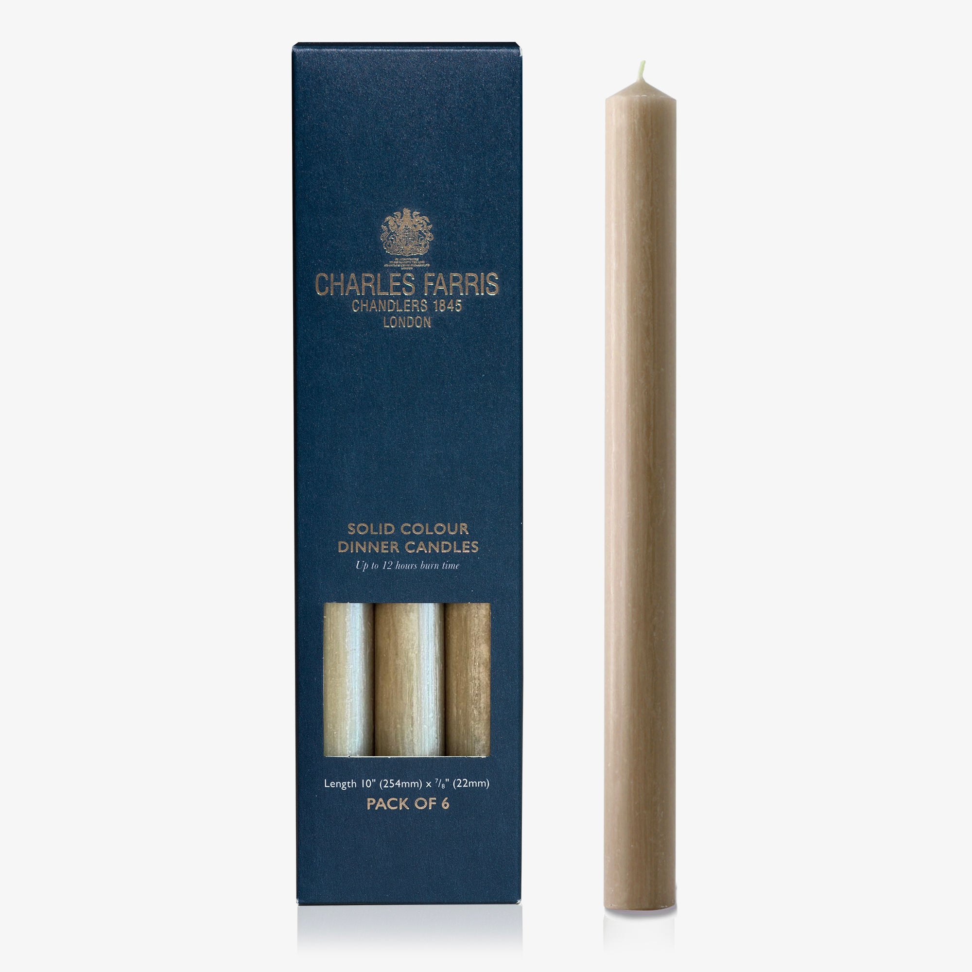 Clay colour dinner candle next to its packaging with 'Charles Farris' branding on a white background