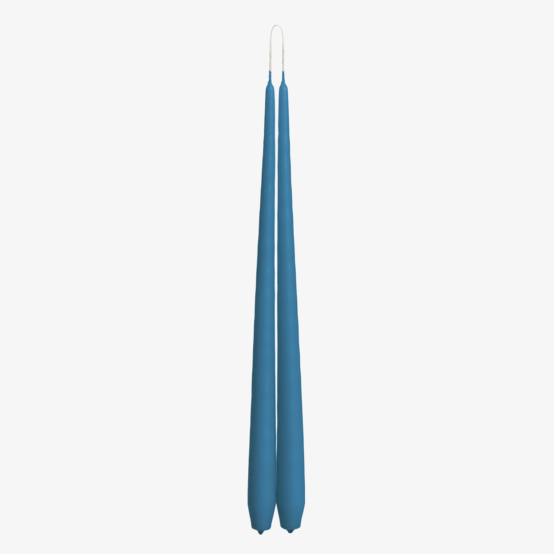 Two blue candles on a white background