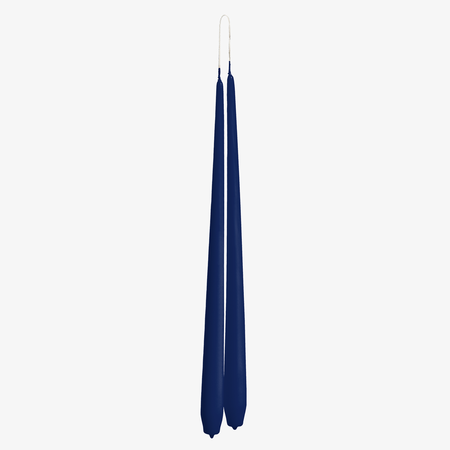 Two navy blue candles on a white background