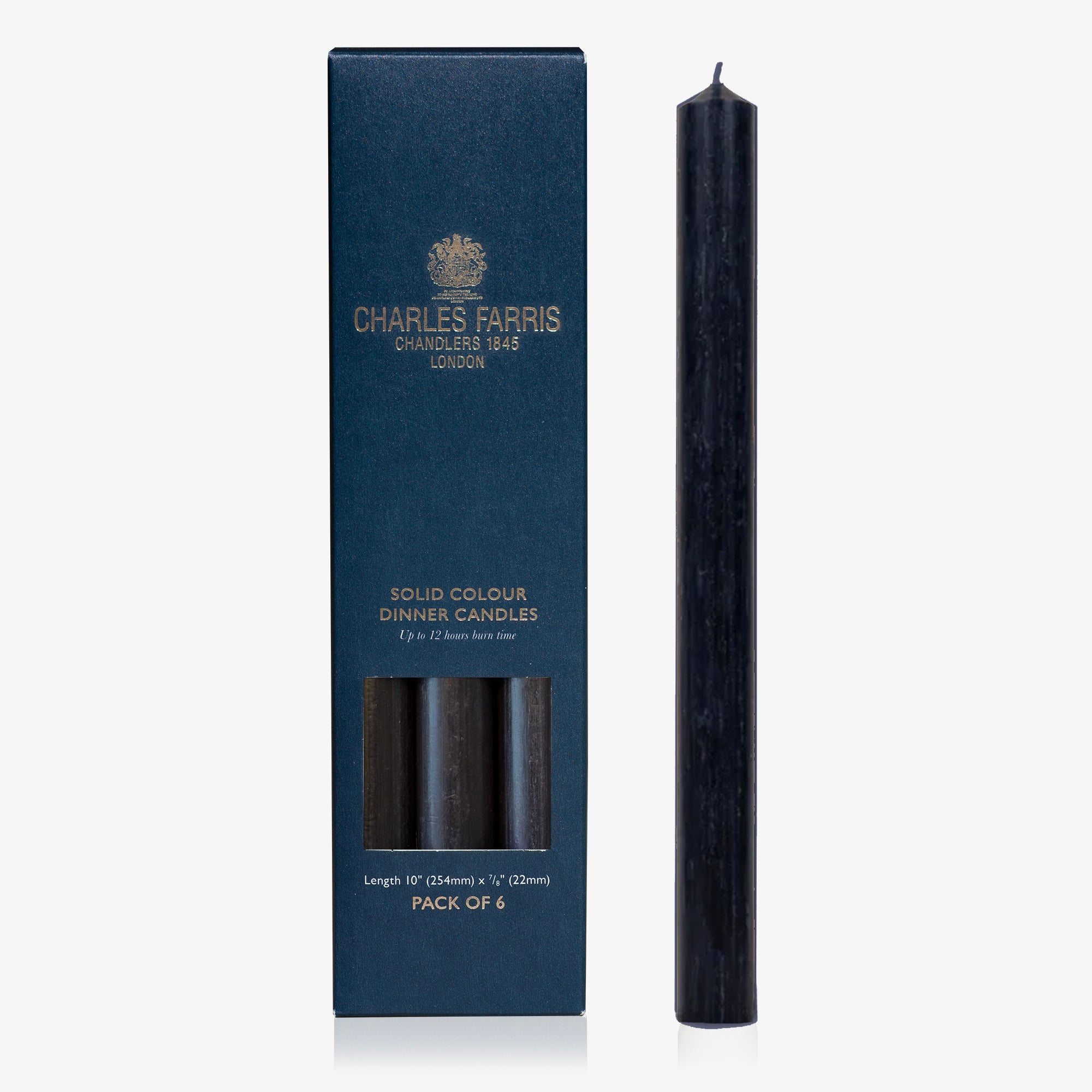 Dark blue candle next to its packaging box with 'Charles Farris' branding on a white background