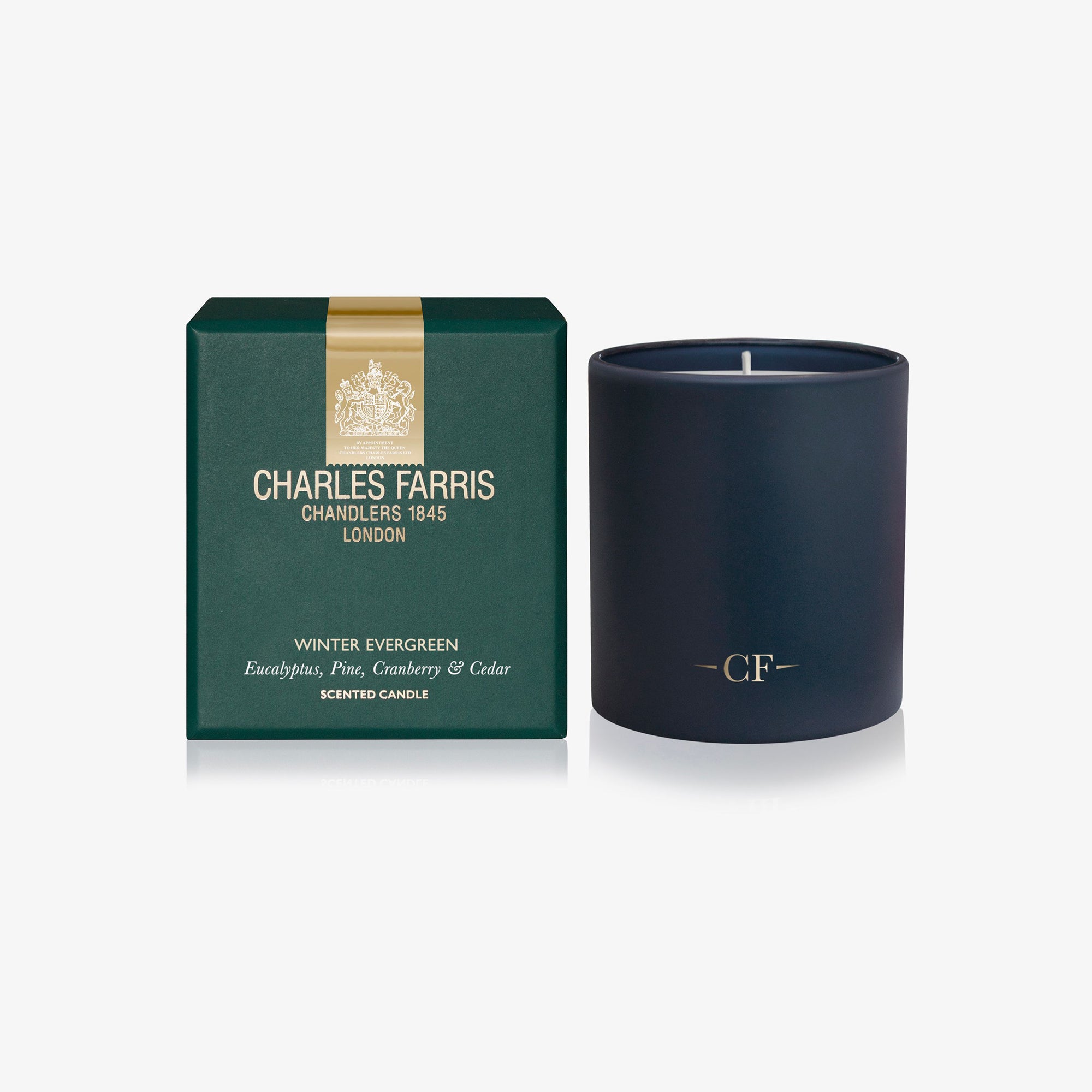 Dark blue candle with 'Charles Farris' packaging on a white background