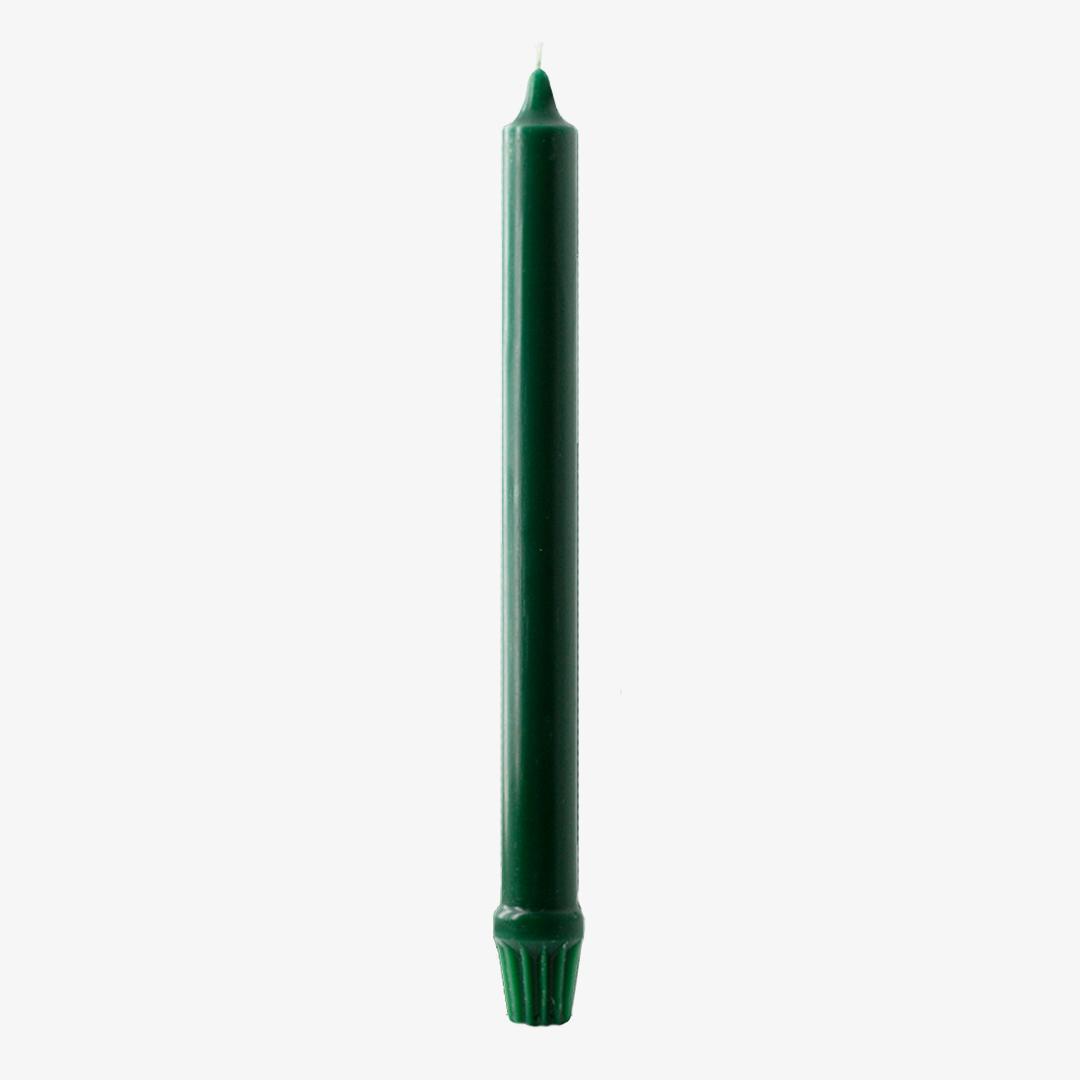 Evergreen fluted dinner candle on a white background