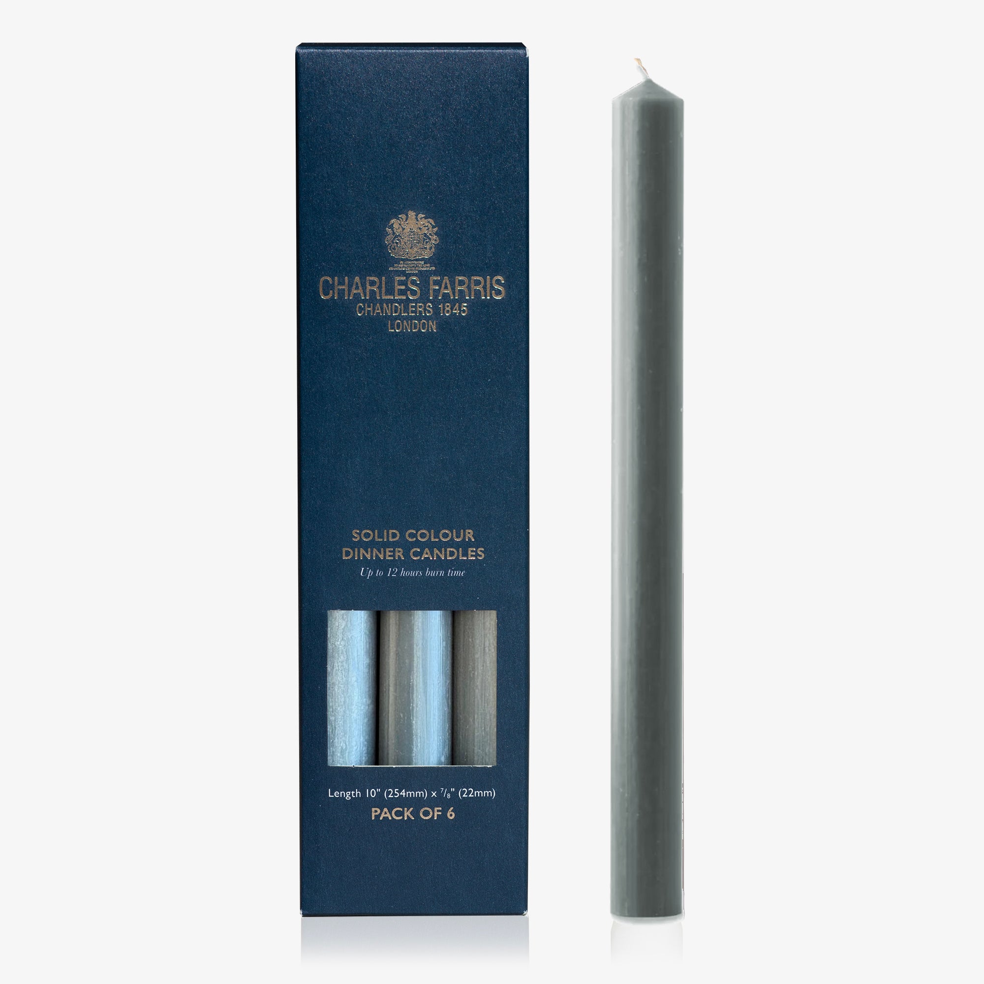 Solid colour flint grey dinner candle with packaging by Charles Farris on a white background