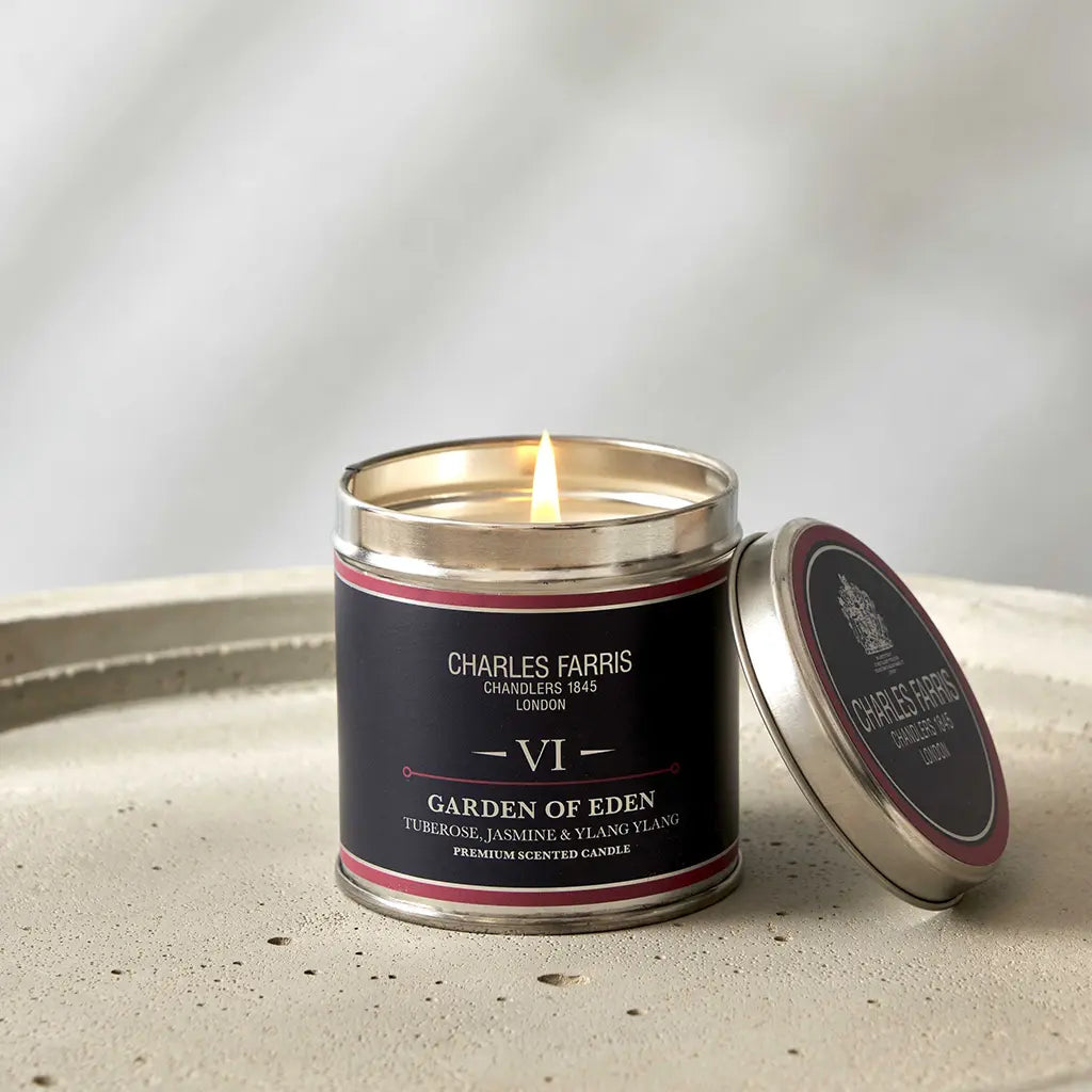 Garden of Eden tin candle by Charles Farris London, tuberose, jasmine & ylang ylang on a stone surface with lid 