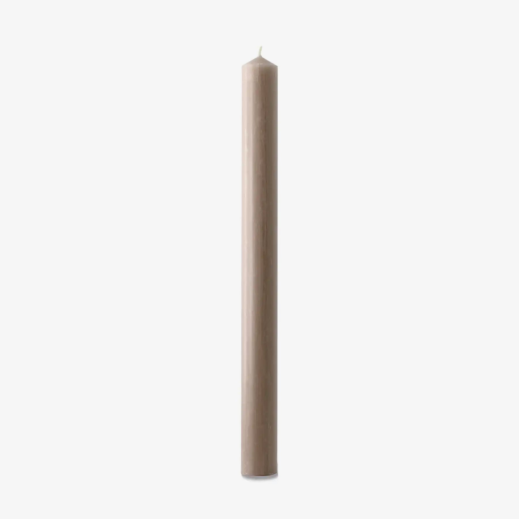 Beige candle on a white background