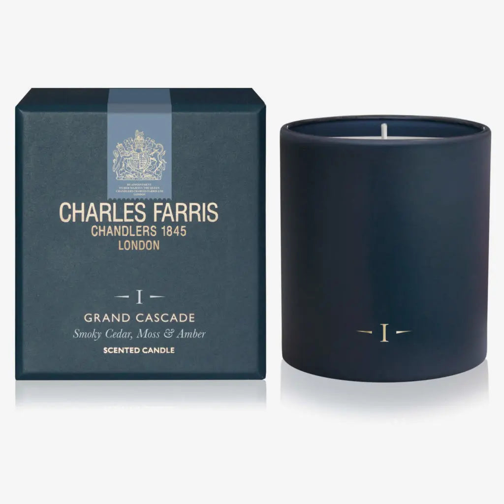 Navy blue candle with 'Charles Farris' packaging on a white background