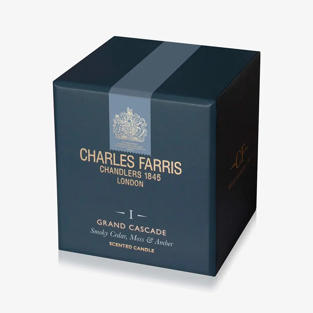 Blue candle box with 'Charles Farris' branding on a white background