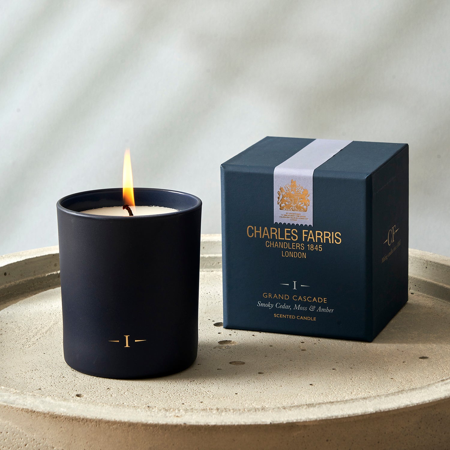 Charles Farris candle and packaging on a neutral background