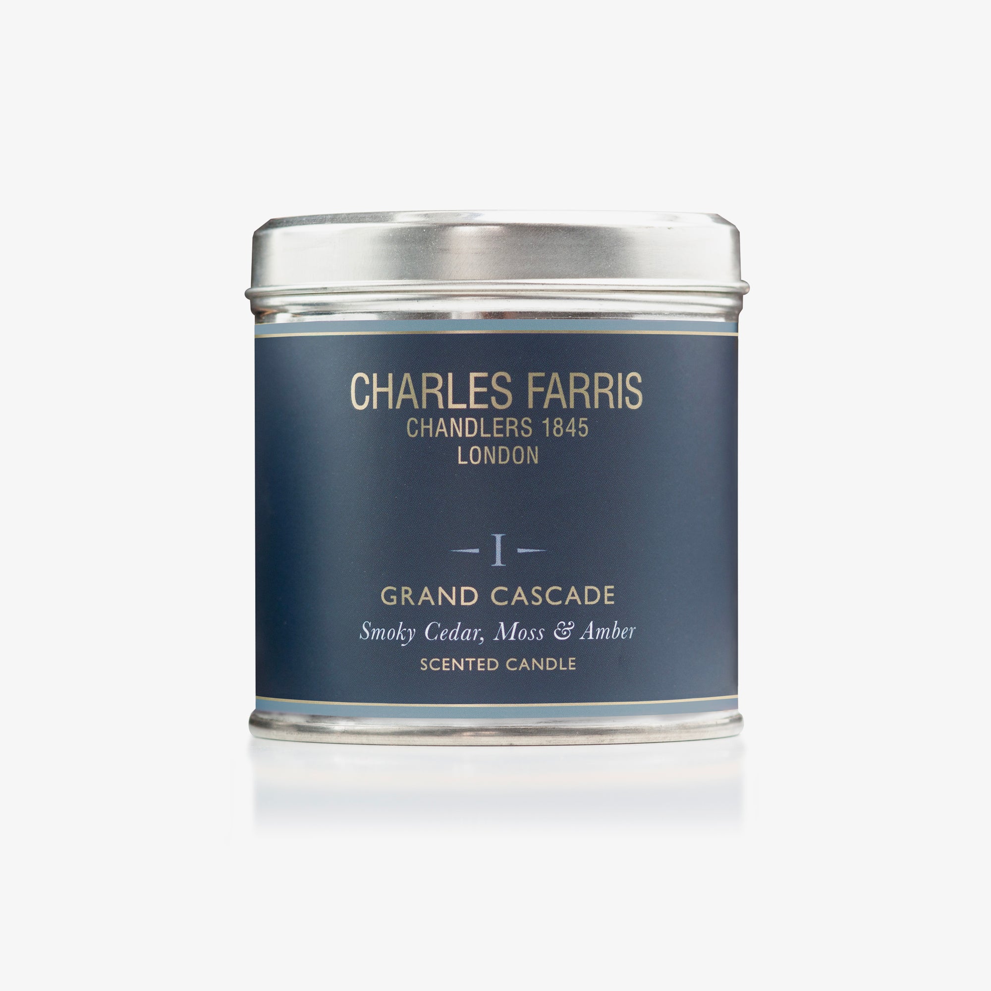 Scented Grand Cascade candle tin labeled 'Charles Farris' on a white background