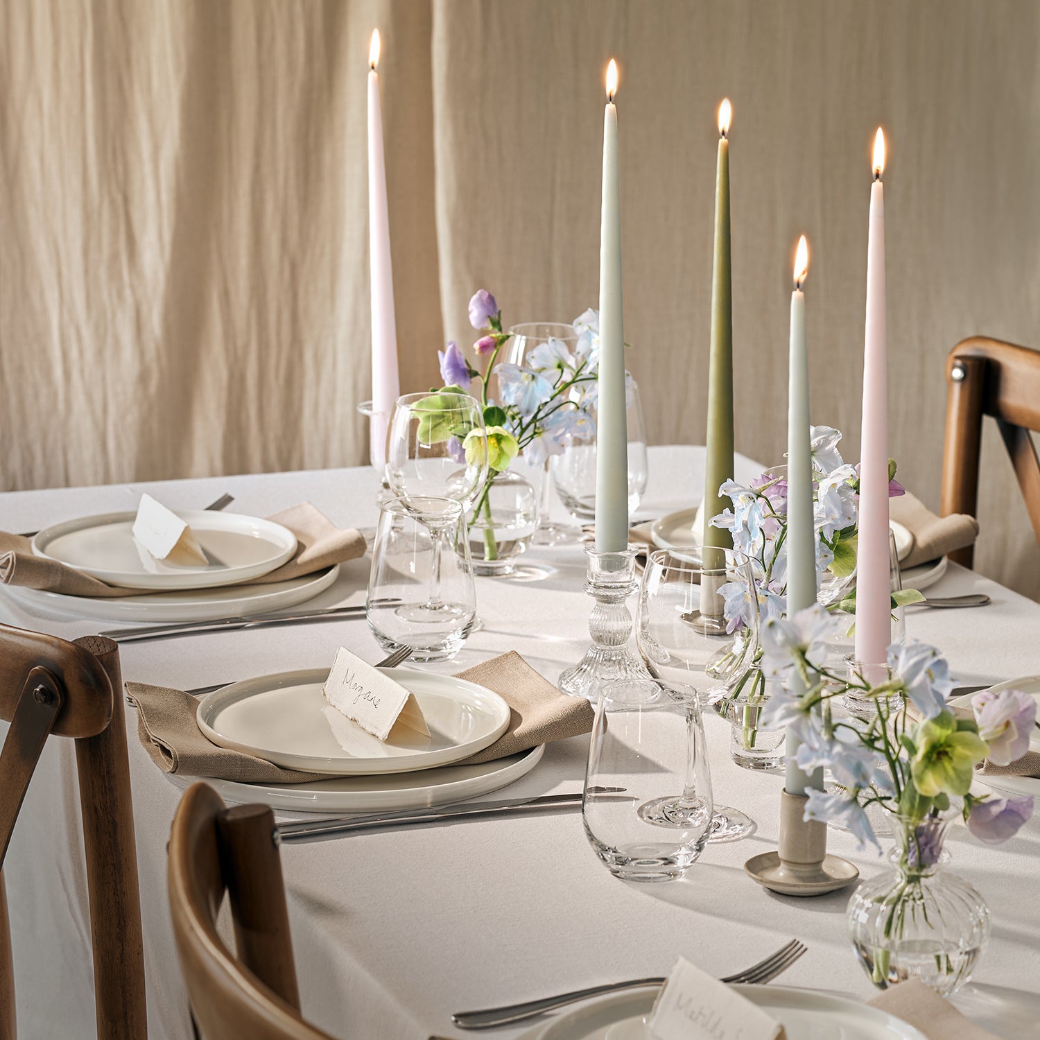 Lit dining candles on a table 