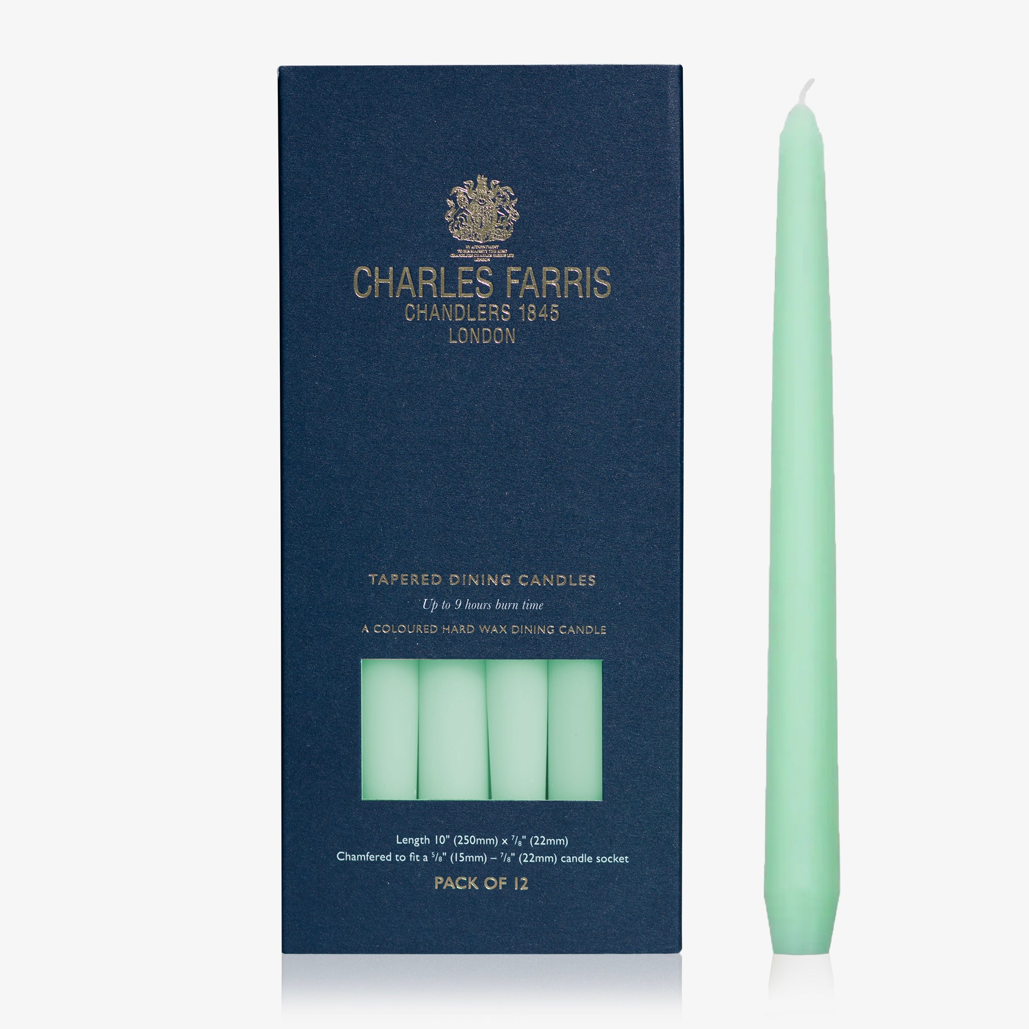 Jade green taper candle next to its packaging with 'Charles Farris' branding on a white background.