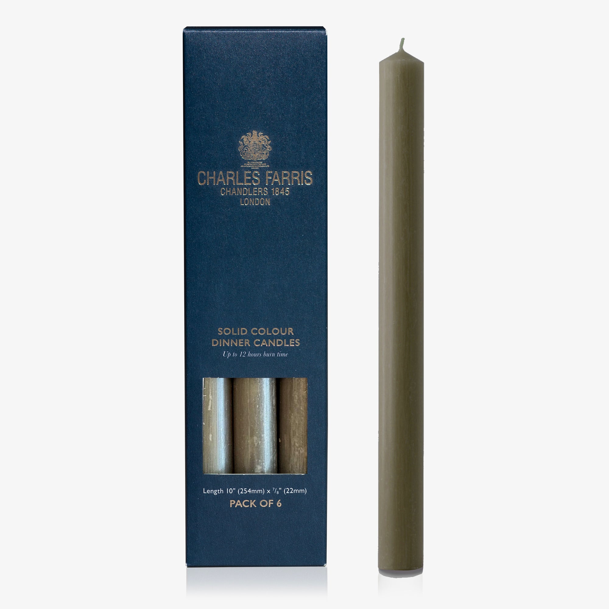 Solid color dinner candle with packaging by Charles Farris on a white background