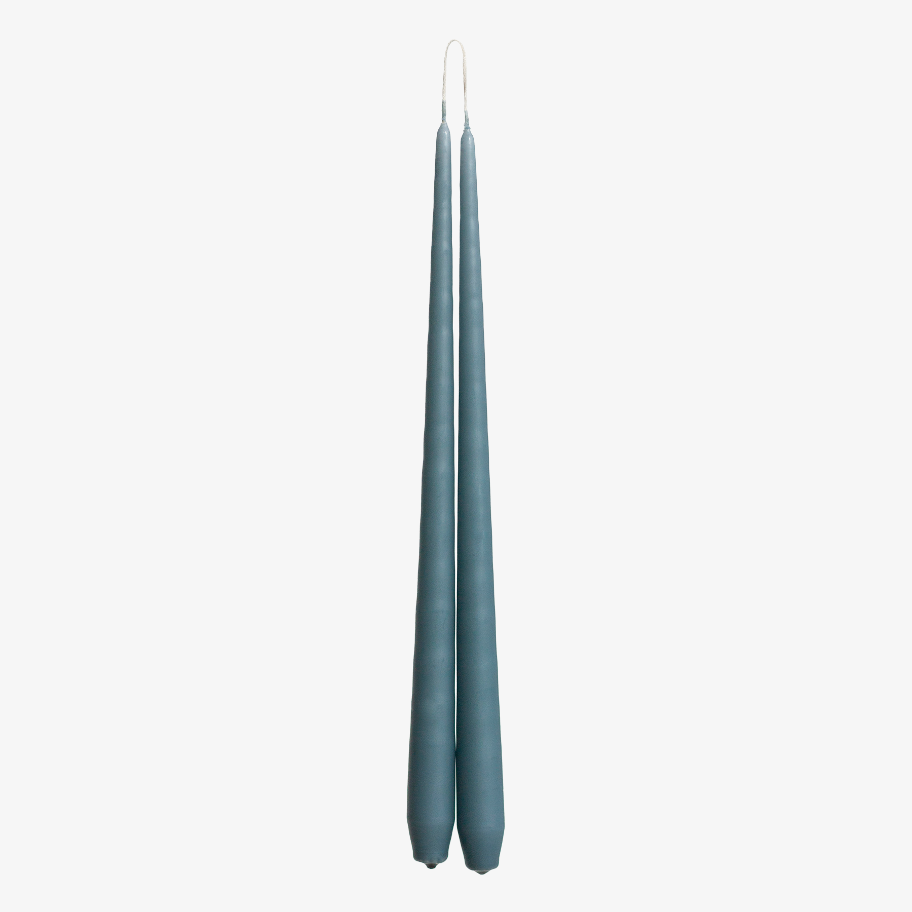 Two blue candles on a white background