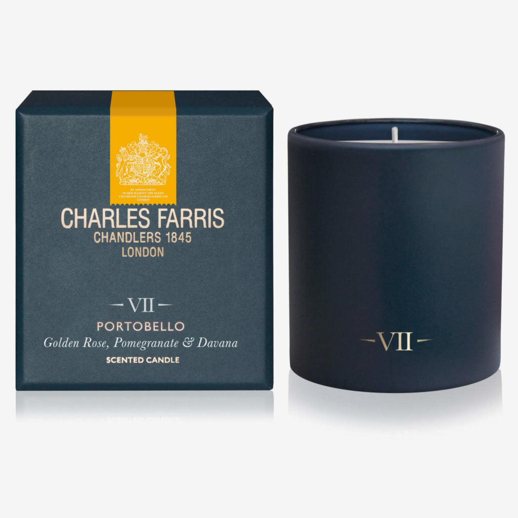 Navy blue candle with 'Charles Farris' packaging on a white background