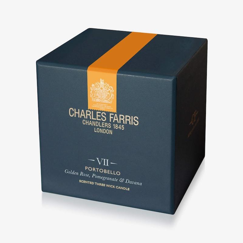 Blue candle box with orange stripe featuring Charles Farris branding on a white background