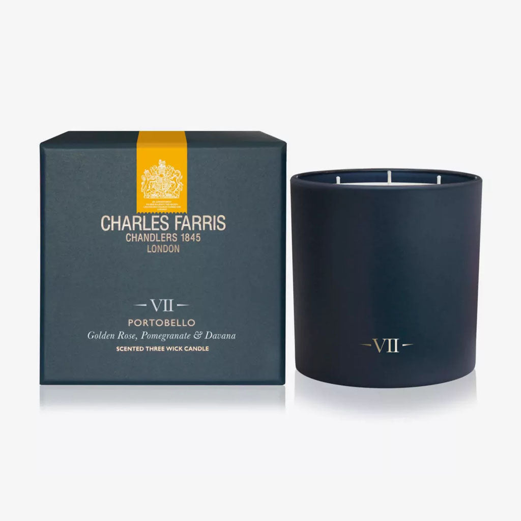 Dark blue candle with 'Charles Farris' packaging on a white background