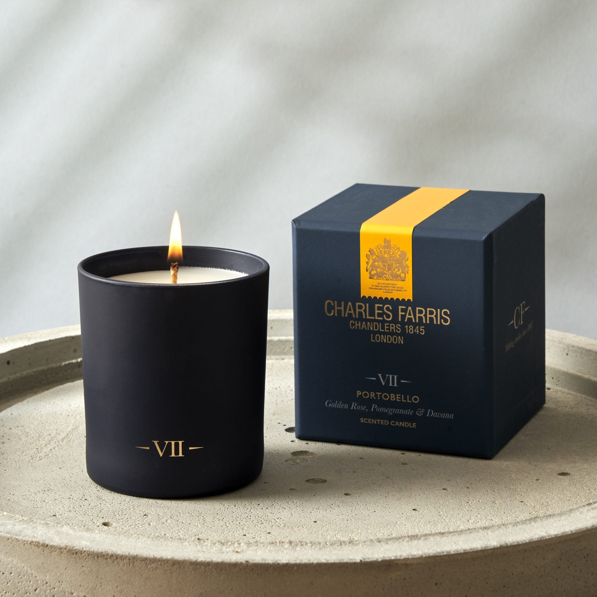 Charles Farris Portobello candle with Charles Farris packaging on a neutral background