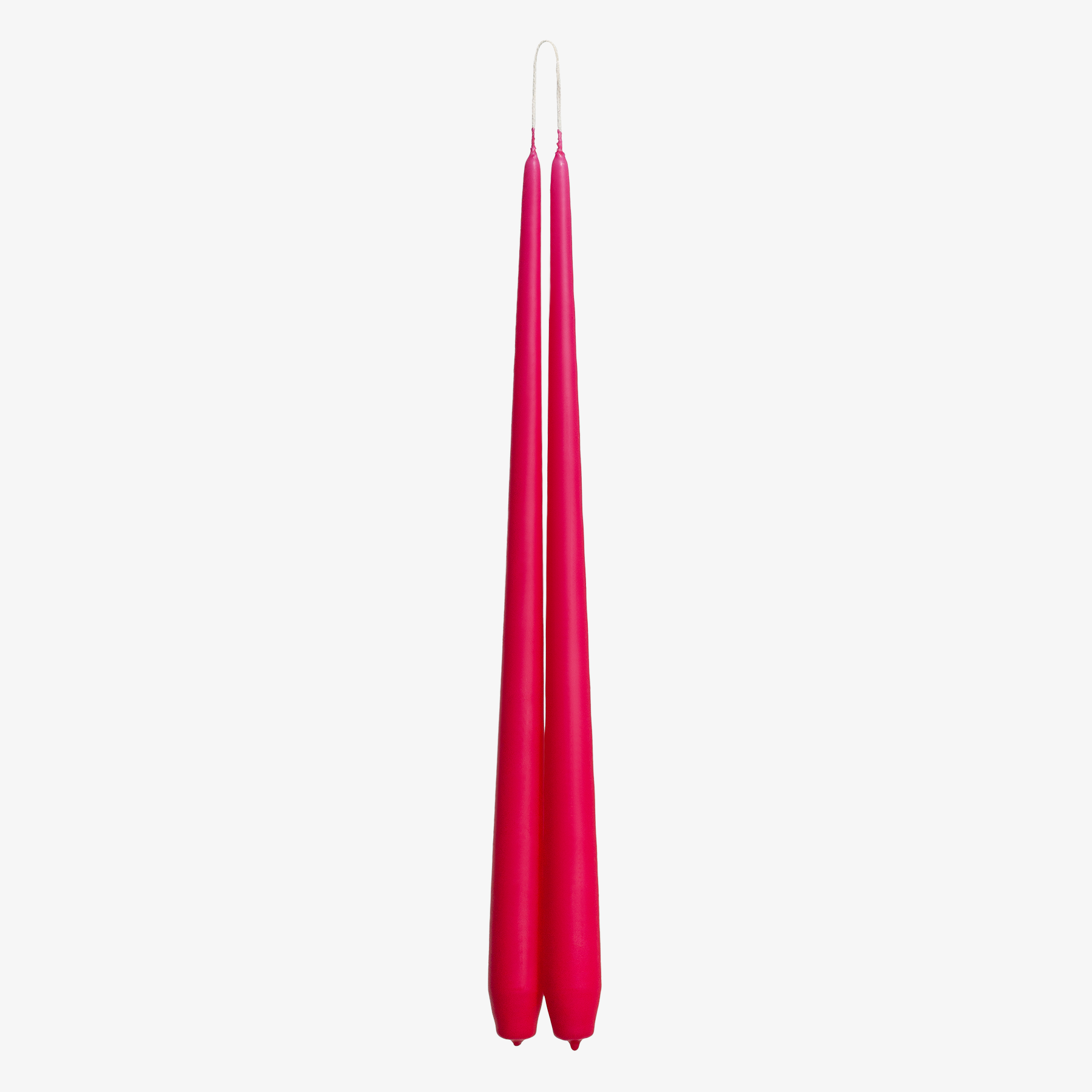Two pink candles on a white background