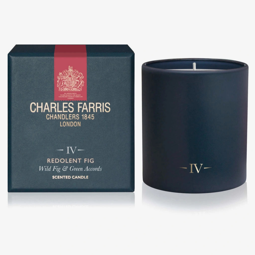 Navy blue candle with 'IV' logo and matching box featuring Charles Farris branding on a white background.