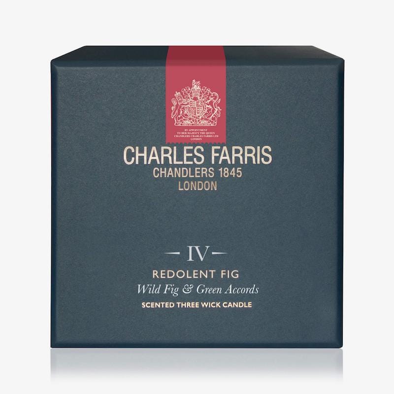 Blue box of Charles Farris candle with red ribbon and brand logo