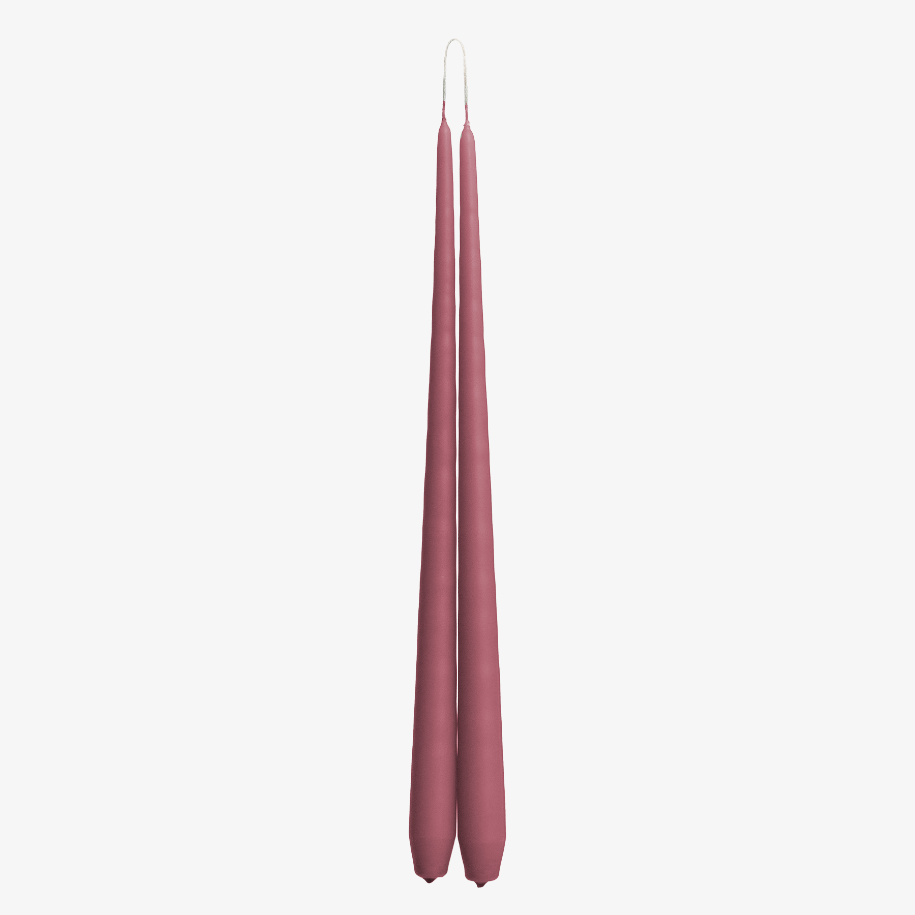 Two pink candles on a white background