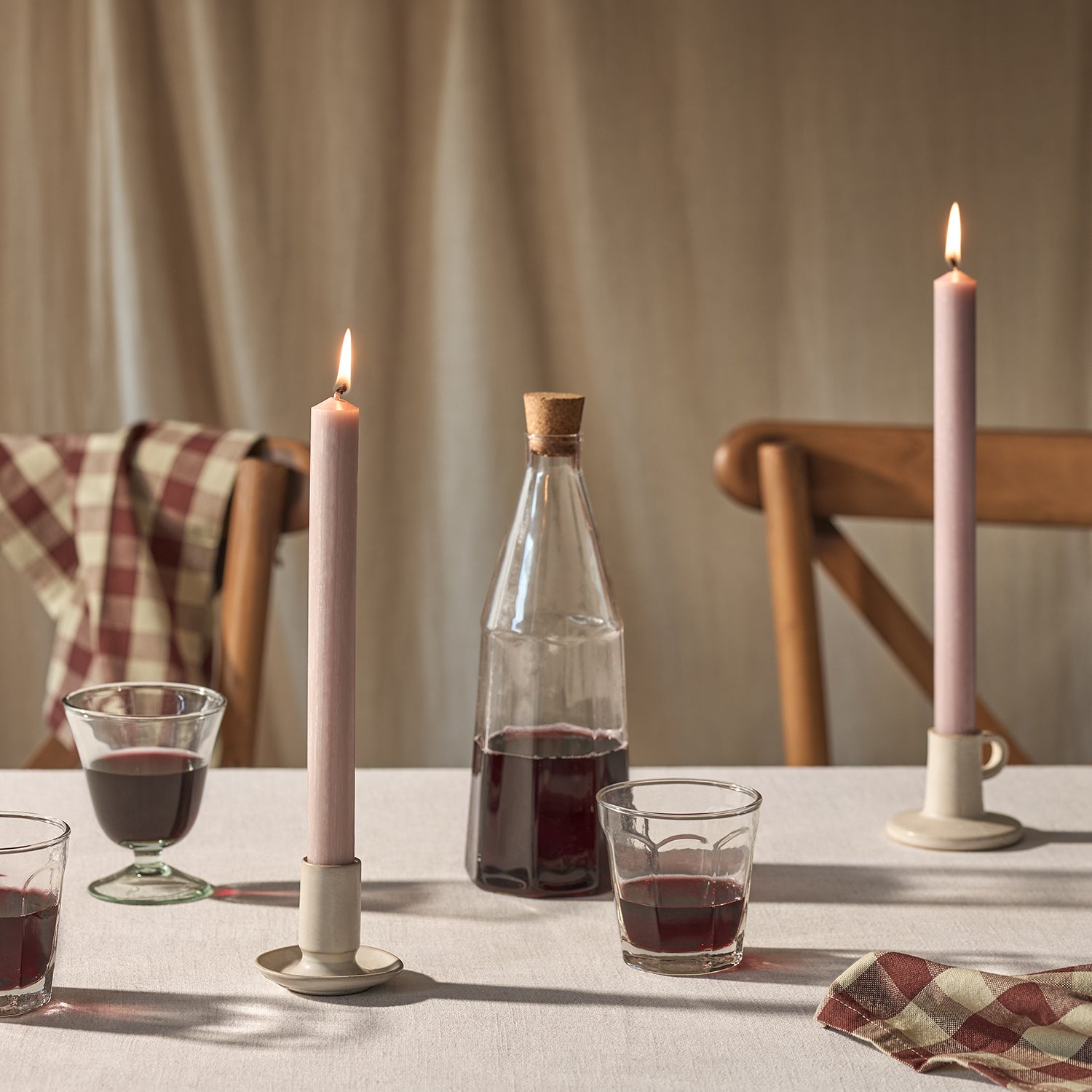 Pink dinner candles on a dining table