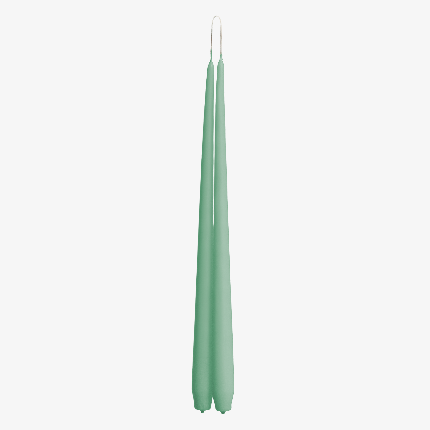 Two green candles on a white background