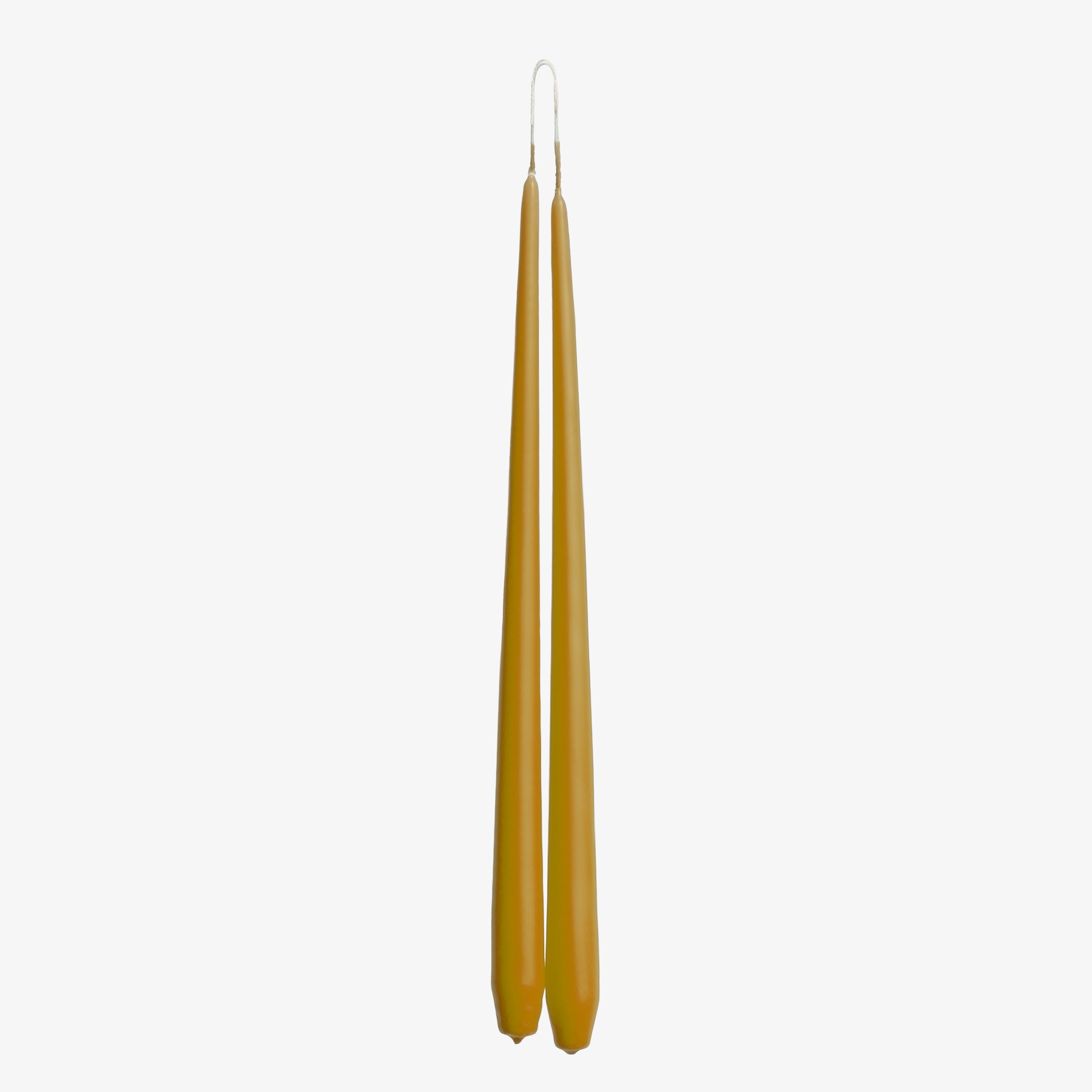 Two gold candles on a white background