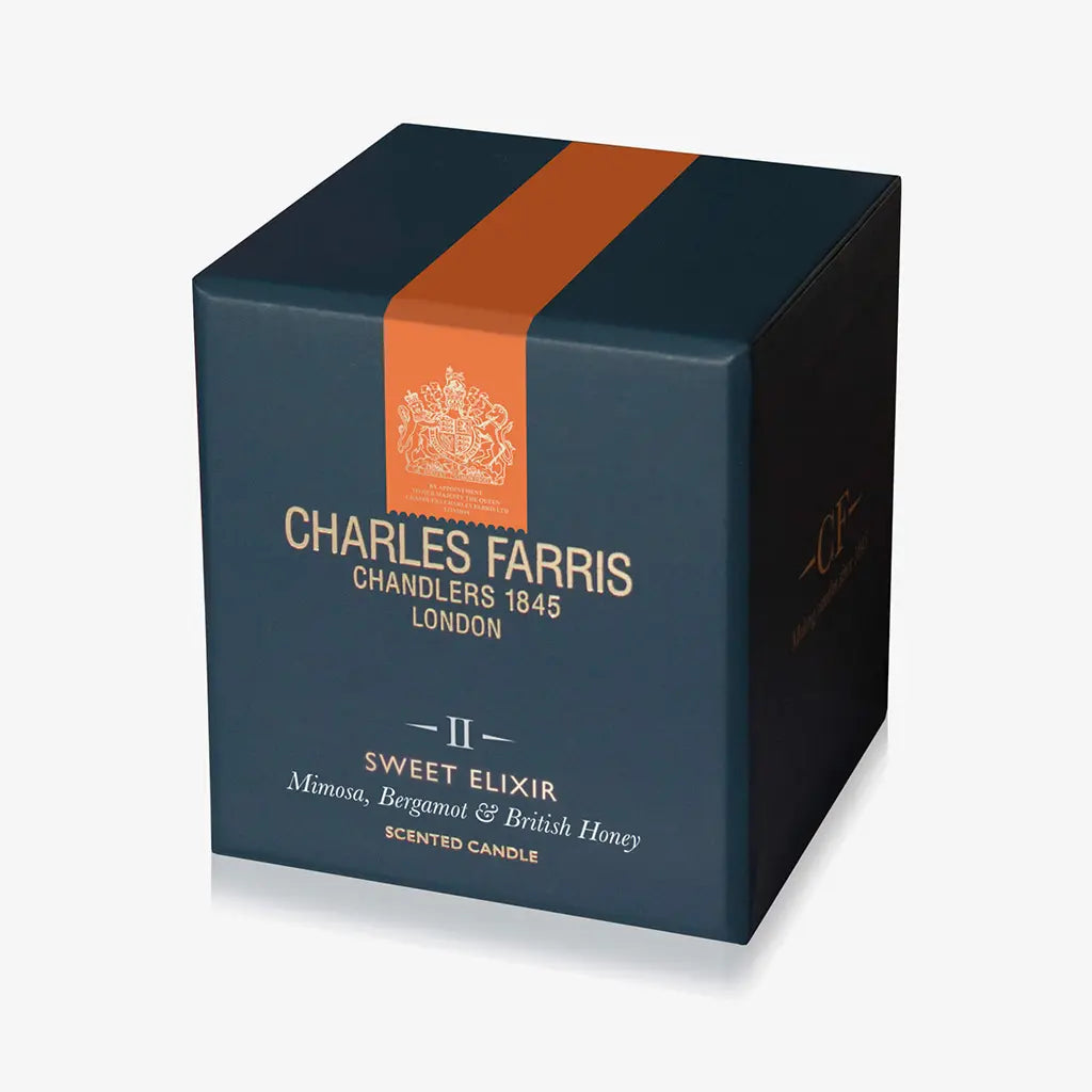 Charles Farris scented candle box with an orange stripe on a white background